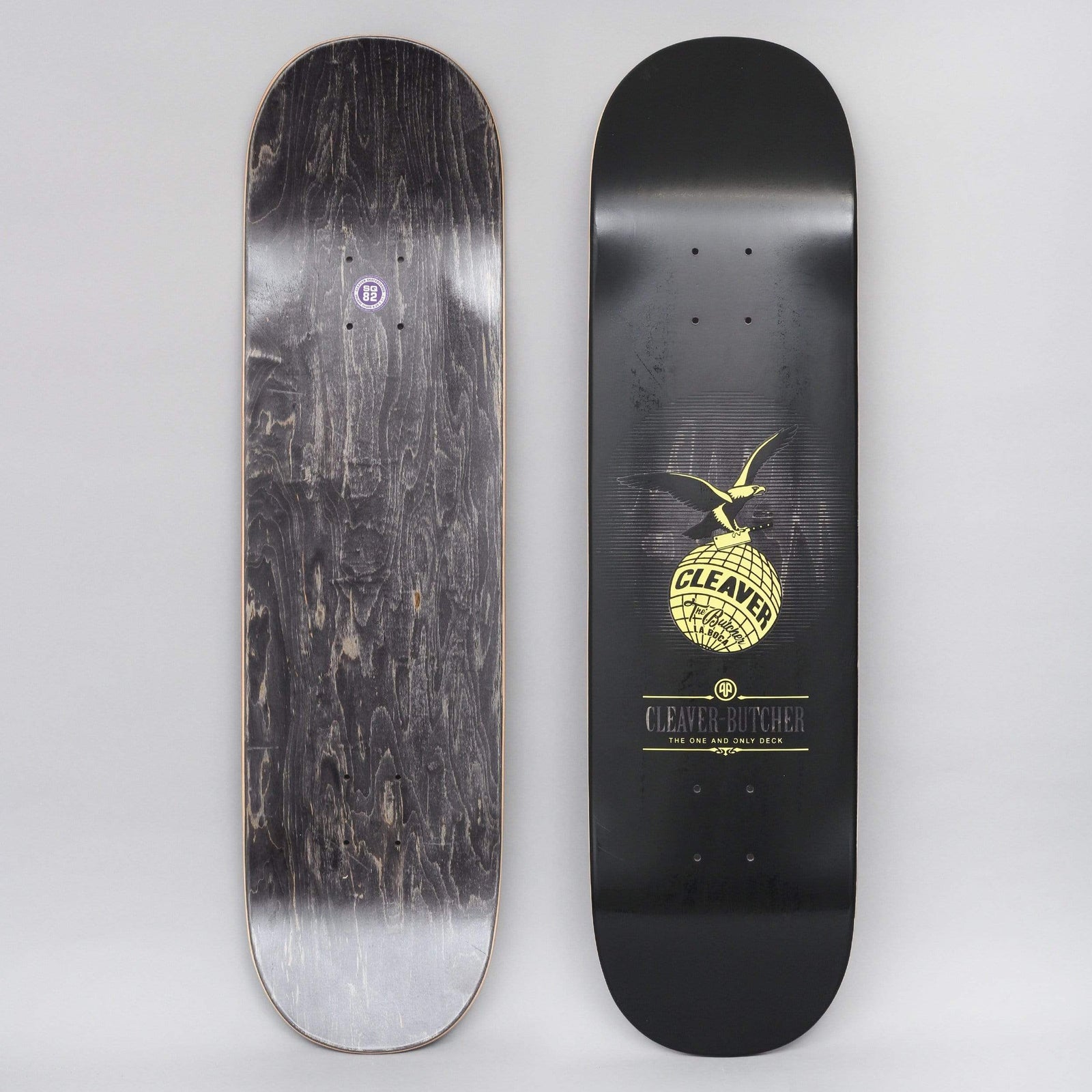 Cleaver Bucchieri Eagle skateboard deck: Black deck with a gold eagle perched on a globe bearing the word 'CLEAVER', in a butcher's-label style. Below is a small crest and the line 'Cleaver-Butcher: The One and Only Deck'.