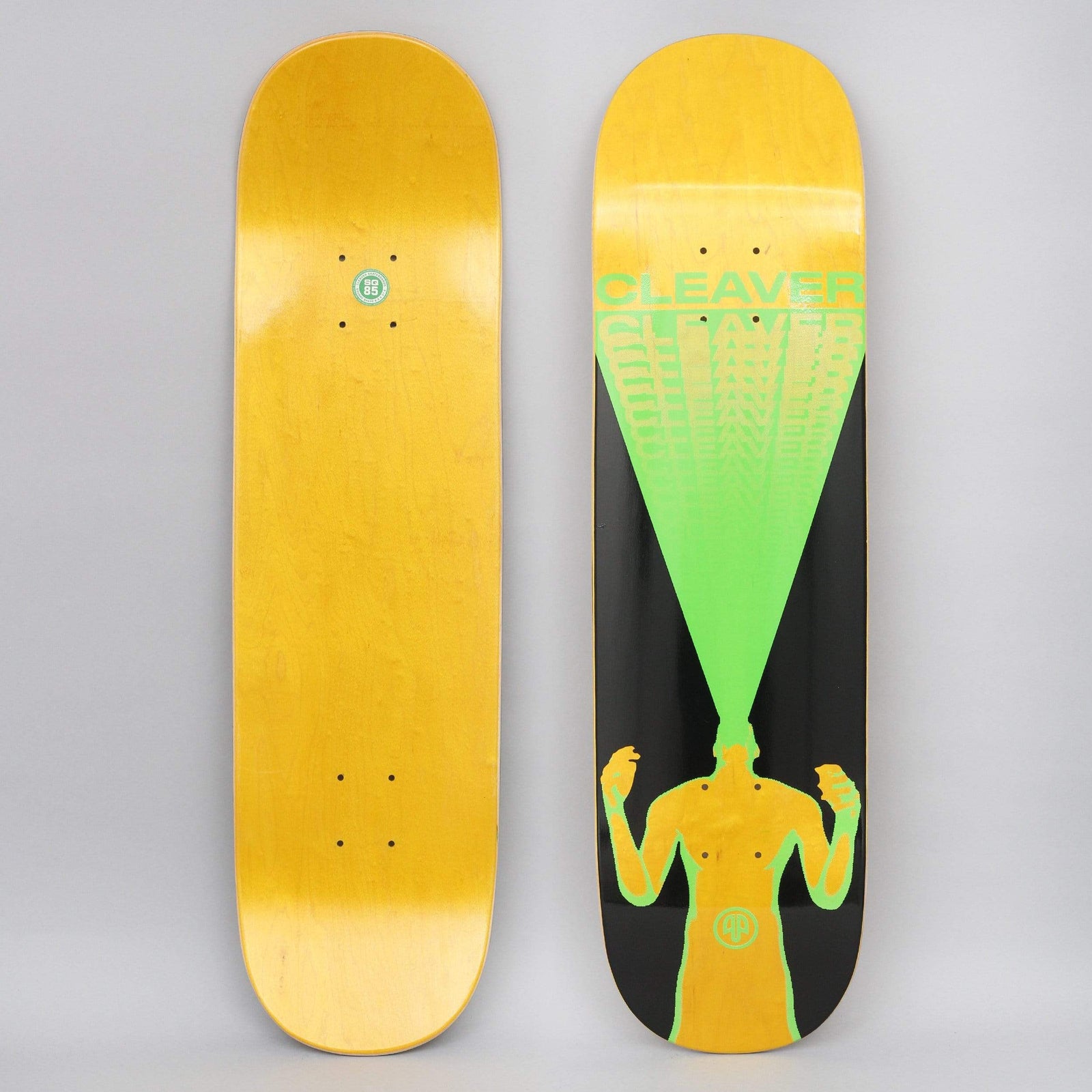 Cleaver Scream Black / Green skateboard deck: Silhouetted figure with raised fists, head replaced by a green beam widening upward into repeating CLEAVER lettering that fades out, on a black panel over a yellow-stained deck.