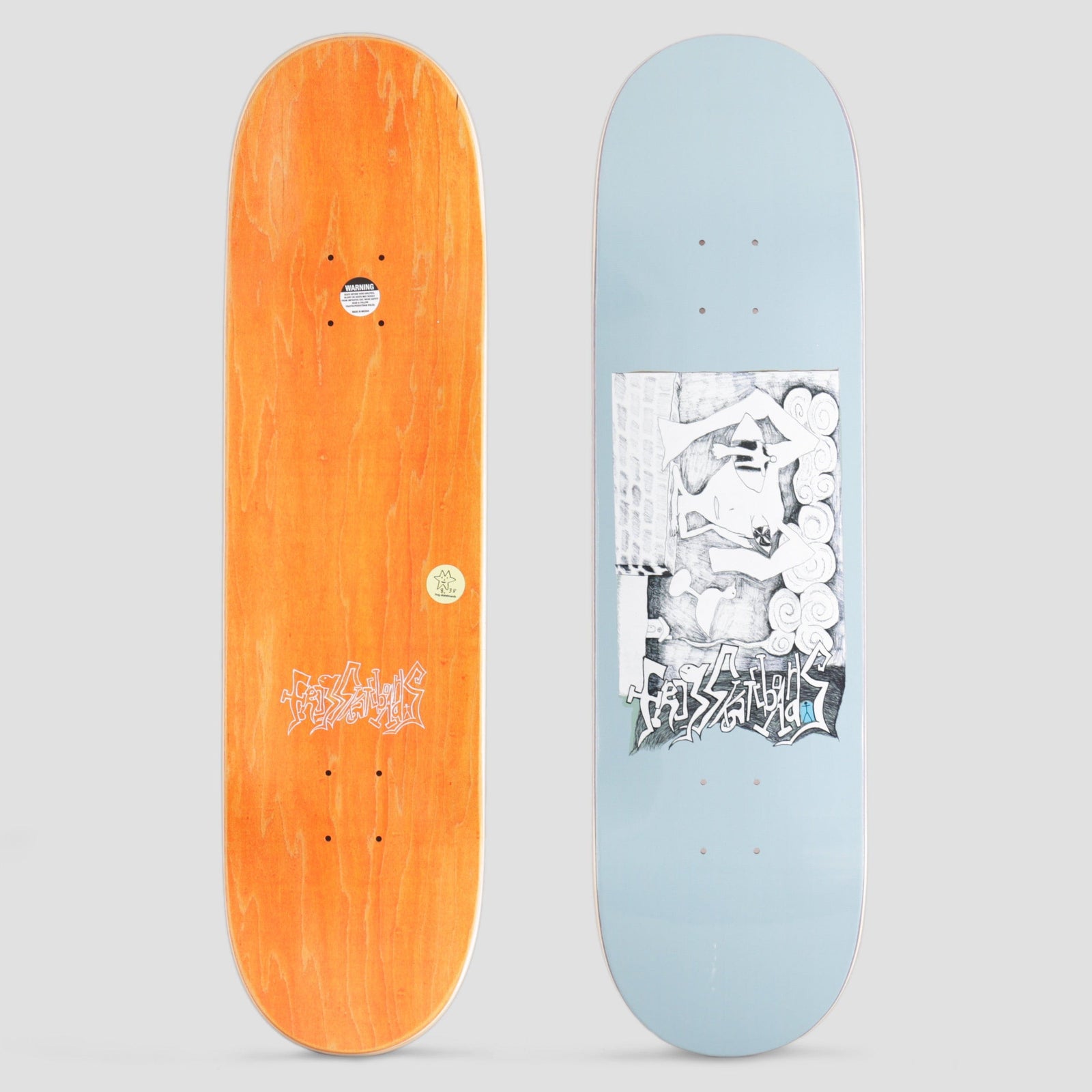 Frog Thinking… Blue skateboard deck: Pencil-style illustration inside a rectangular panel on a pale blue deck: a figure wearing a mask or visor reclines among swirling clouds. Graffiti-style brand lettering sits across the bottom of the panel. Orange underside shown beside it.