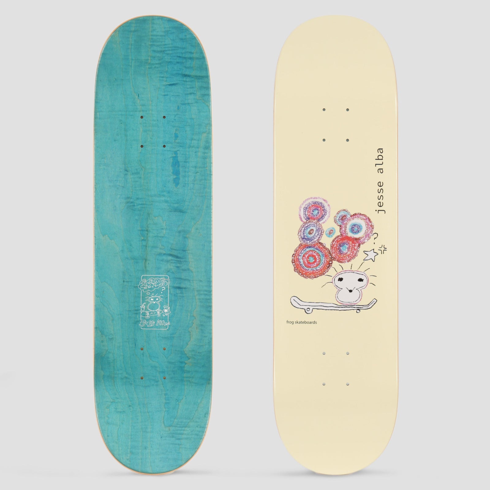 Frog Jesse Alba Yellow skateboard deck: Crayon-style drawing of a small round-faced creature on a skateboard with a cluster of red, pink and blue swirled circles above its head and a star beside it. Cream deck with rider name in vertical text.
