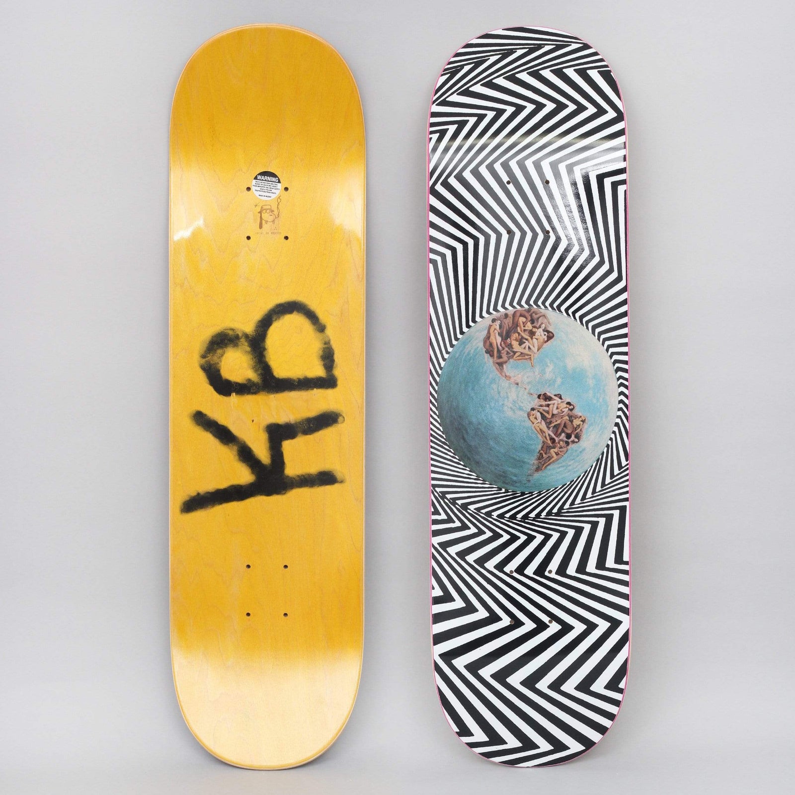 Fucking Awesome World Fucking Black / White skateboard deck: Blue-and-brown globe floating in a hypnotic black and white zigzag vortex, its continents made of tangled nude bodies. Underside has a spray-painted KB tag on a yellow stain.