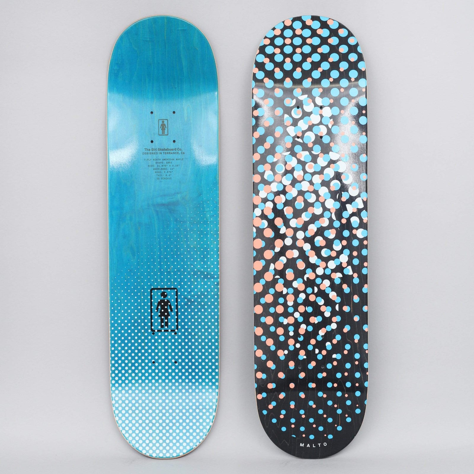 Girl Sean Malto Dot OG skateboard deck: A halftone-style scatter of peach, light blue and white dots across a black deck, with the rider name in small print at the tail. The photo also shows the blue-stained bottom with a halftone fade and Girl logo.