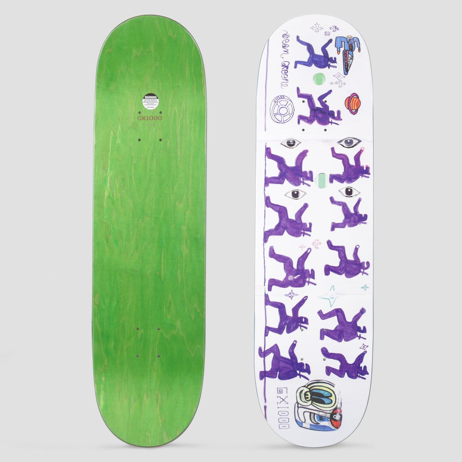 GX1000 Ninjas Greene skateboard deck: Crayon-style drawing of rows of purple ninja figures in jumping poses, with watching eyes, stars, a planet and a tiny helmeted character, on a white deck. GX1000 and the rider's name are written in marker.