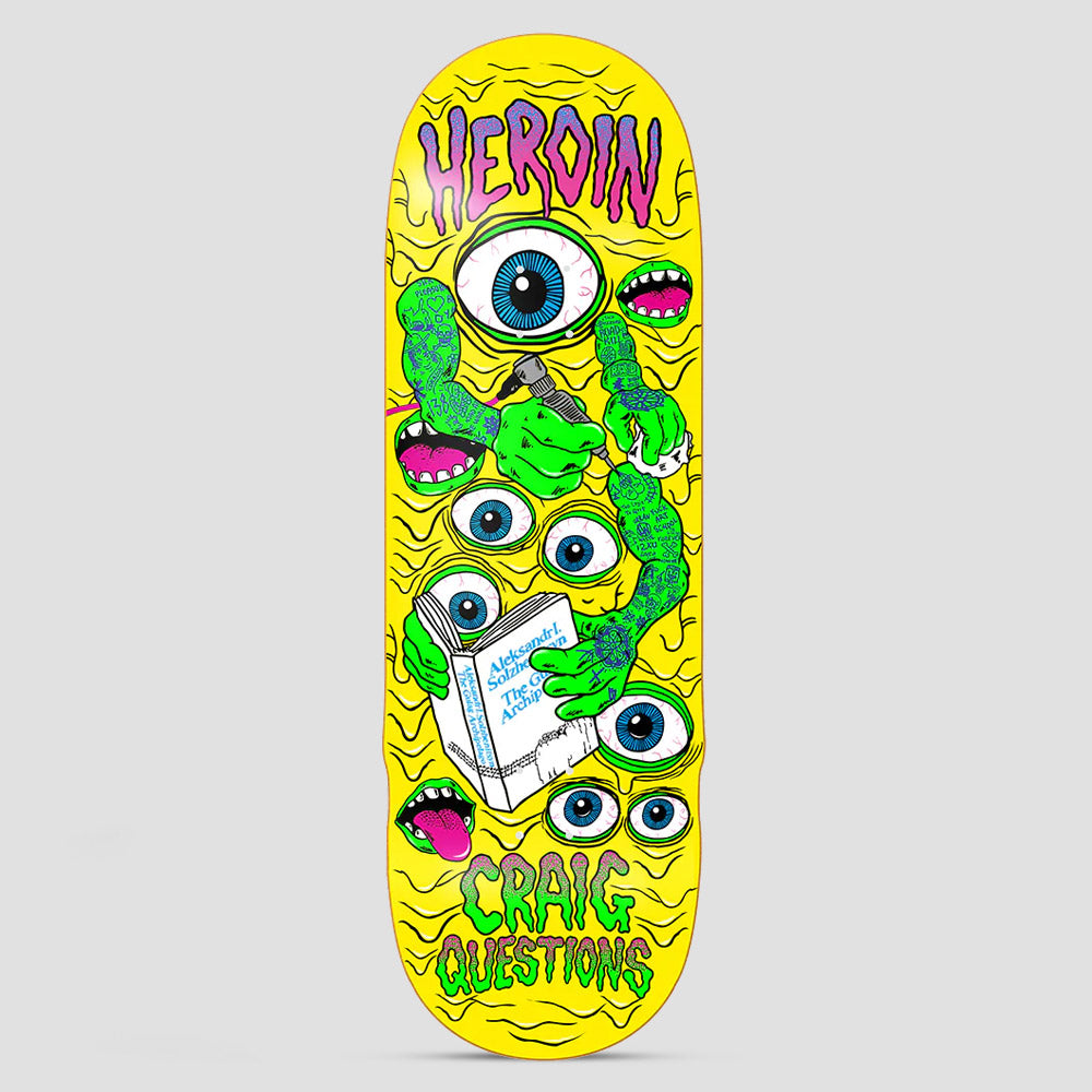 Heroin Craig Questions Mutate or Die skateboard deck: Yellow deck covered in wavy lines and green tattooed monster arms, one holding a tattoo machine and one a book, among blue eyeballs and pink mouths, with dripping green and purple lettering at both ends.
