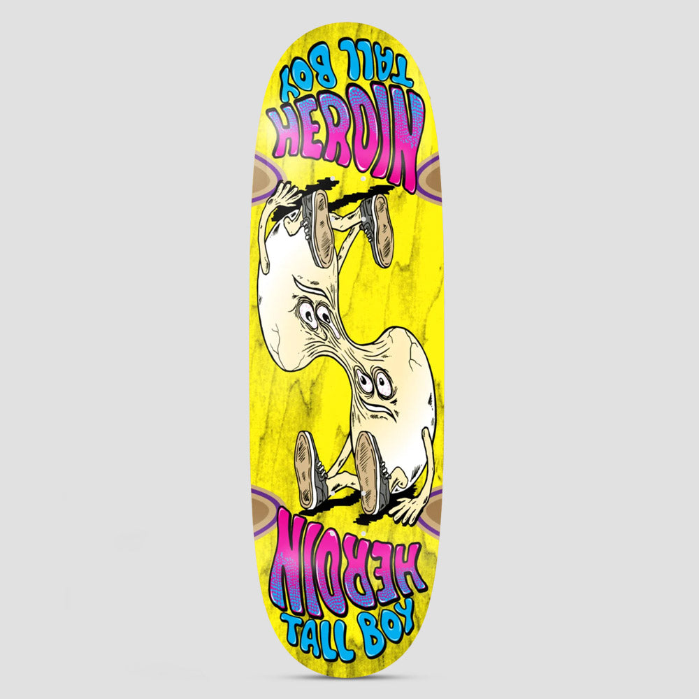 Heroin Tall Boy Merged skateboard deck: Wide egg-shaped yellow deck with a mirrored cartoon of two pale, wide-eyed figures in trainers stretched and merged at the waist, with pink and blue Heroin Tall Boy lettering at each end, one set upside down.