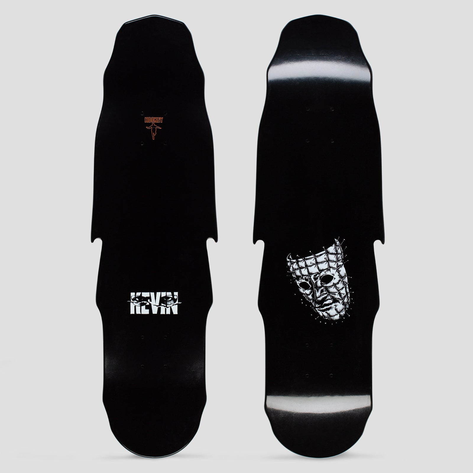 Hockey Kevin Rodrigues Tsunami Black skateboard deck: Black shaped deck with a white pin-studded grid mask face near the tail, and the rider's first name in white cut-out lettering on the other view. Small orange Hockey logo at the top.