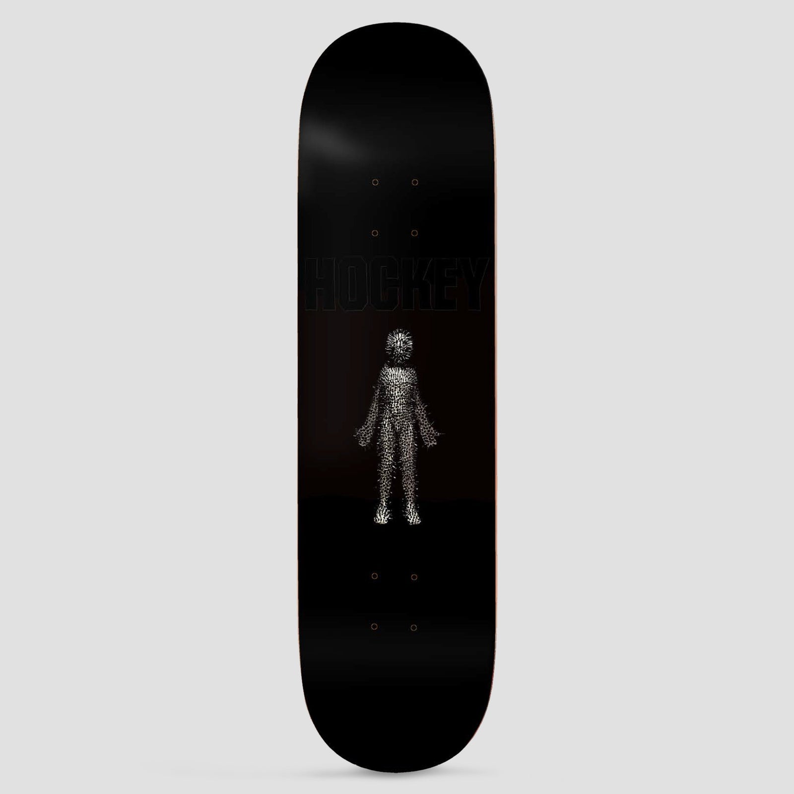 Hockey Newborn: Donovon Piscopo Shape 1 skateboard deck: Black deck with a small human figure made of fine spiky pins or particles, and a faint black-on-black Hockey logo above it.