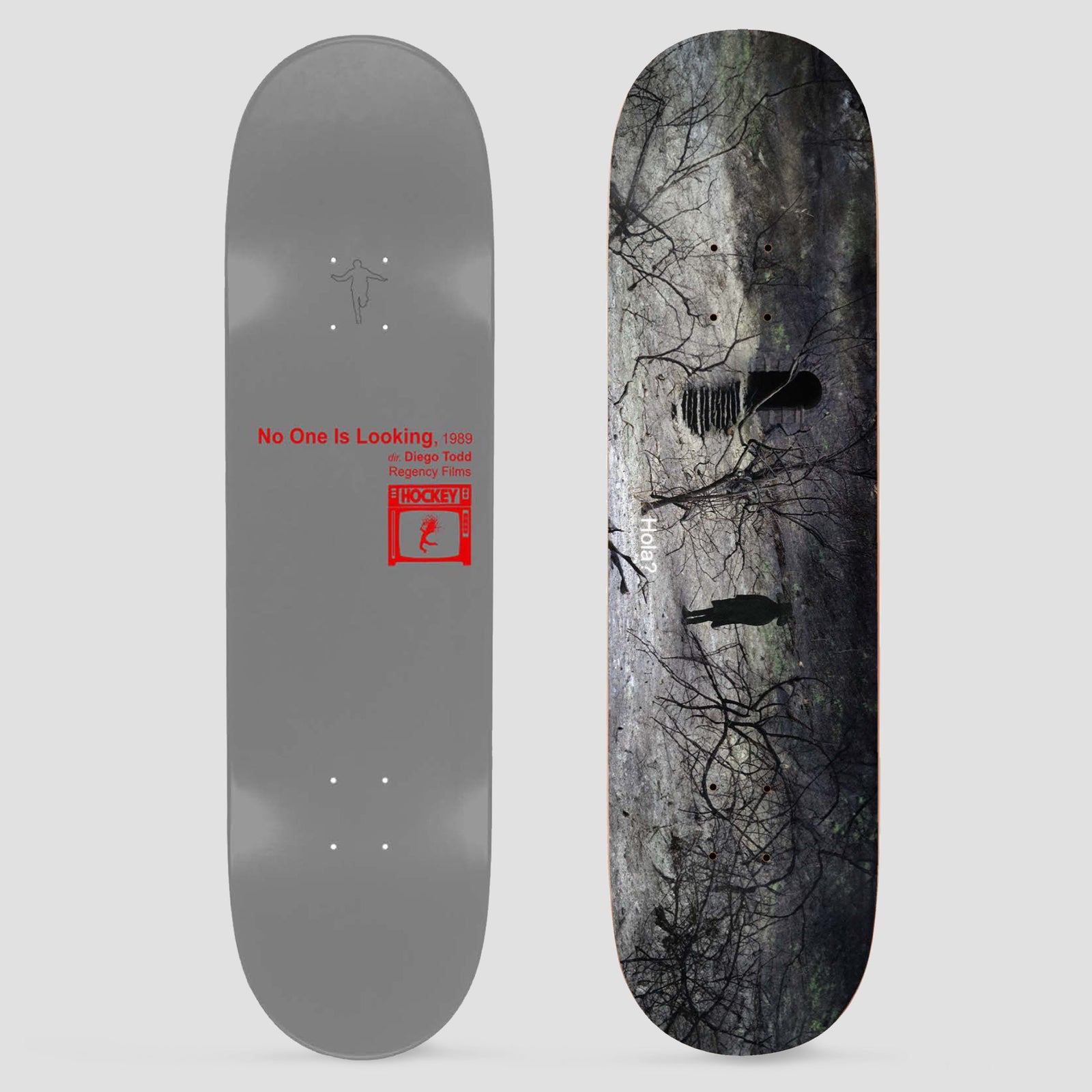 Hockey No One Is Looking Diego Todd Shape 2 skateboard deck: Top graphic is a dark photo of bare branches over a muddy landscape with two small silhouetted figures and the word 'hola'. The other side is plain grey with red text crediting the film 'No One Is Looking' and a Hockey TV logo.