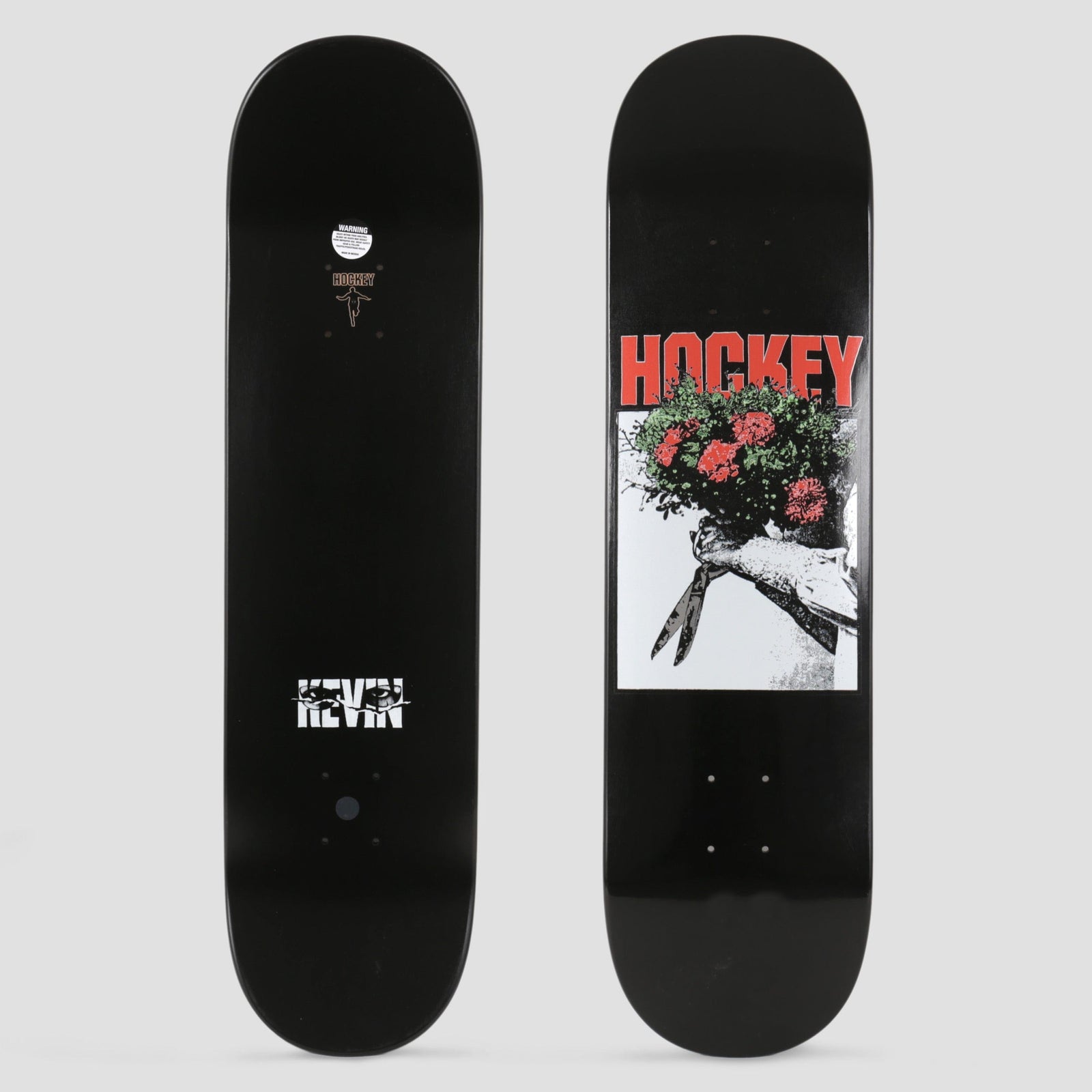 Hockey Kevin Rodrigues Roses skateboard deck: A black and white photo of a hand holding garden shears and a bunch of red roses, under large red HOCKEY lettering, on a black deck. The underside has a KEVIN credit near the tail.