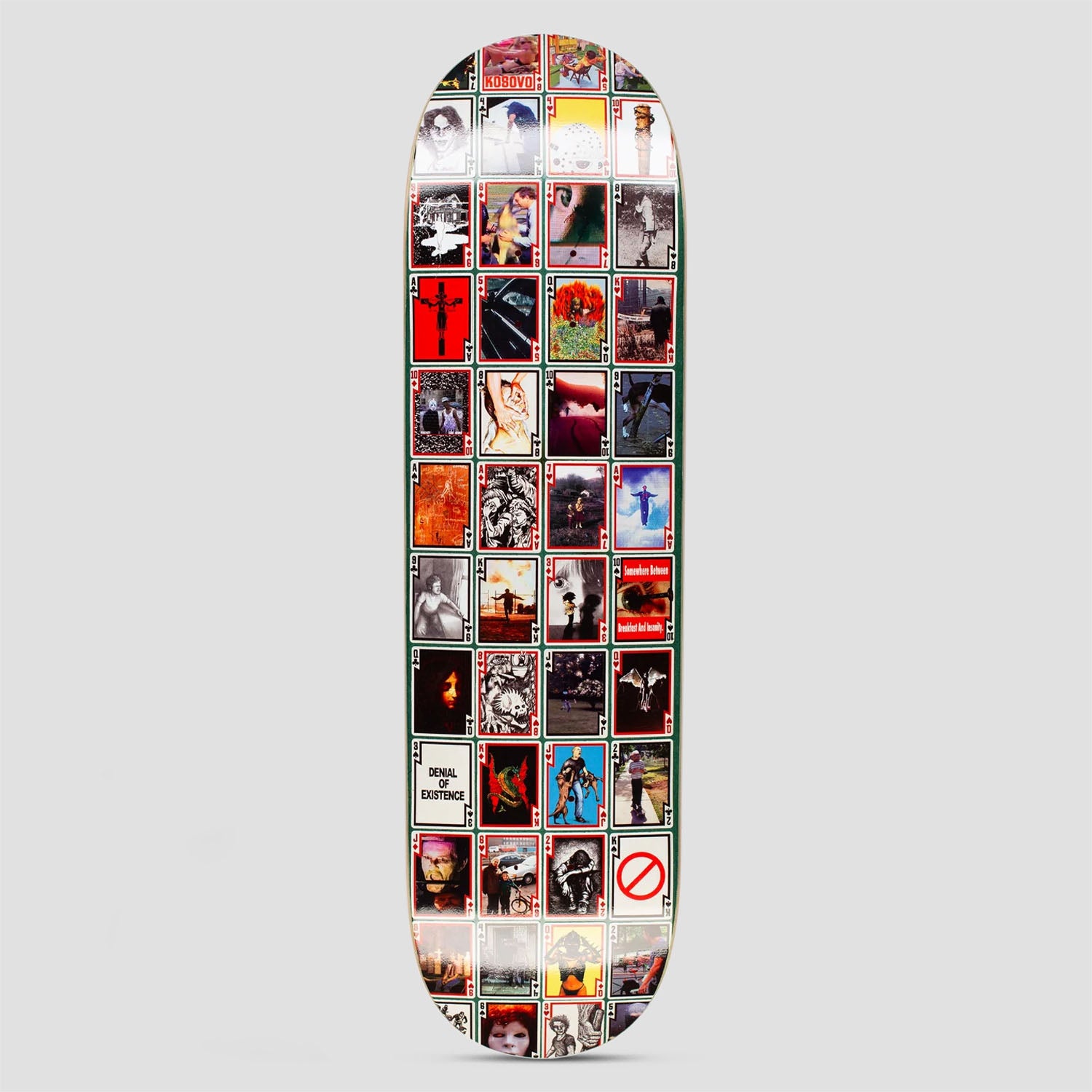 Hockey Playing Cards Shape 2 skateboard deck: Grid of dozens of small playing-card style images, each a different photo or illustration, such as portraits, crosses and flowers, with a card reading Denial of Existence and a no-entry symbol card.