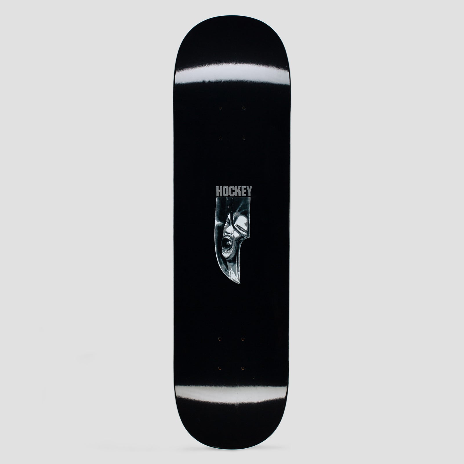 Hockey R and R Shape 1 Black skateboard deck: Black deck with white blurred streaks near the nose and tail. A small monochrome image of a screaming face in a knife-blade shape sits under the Hockey logo.