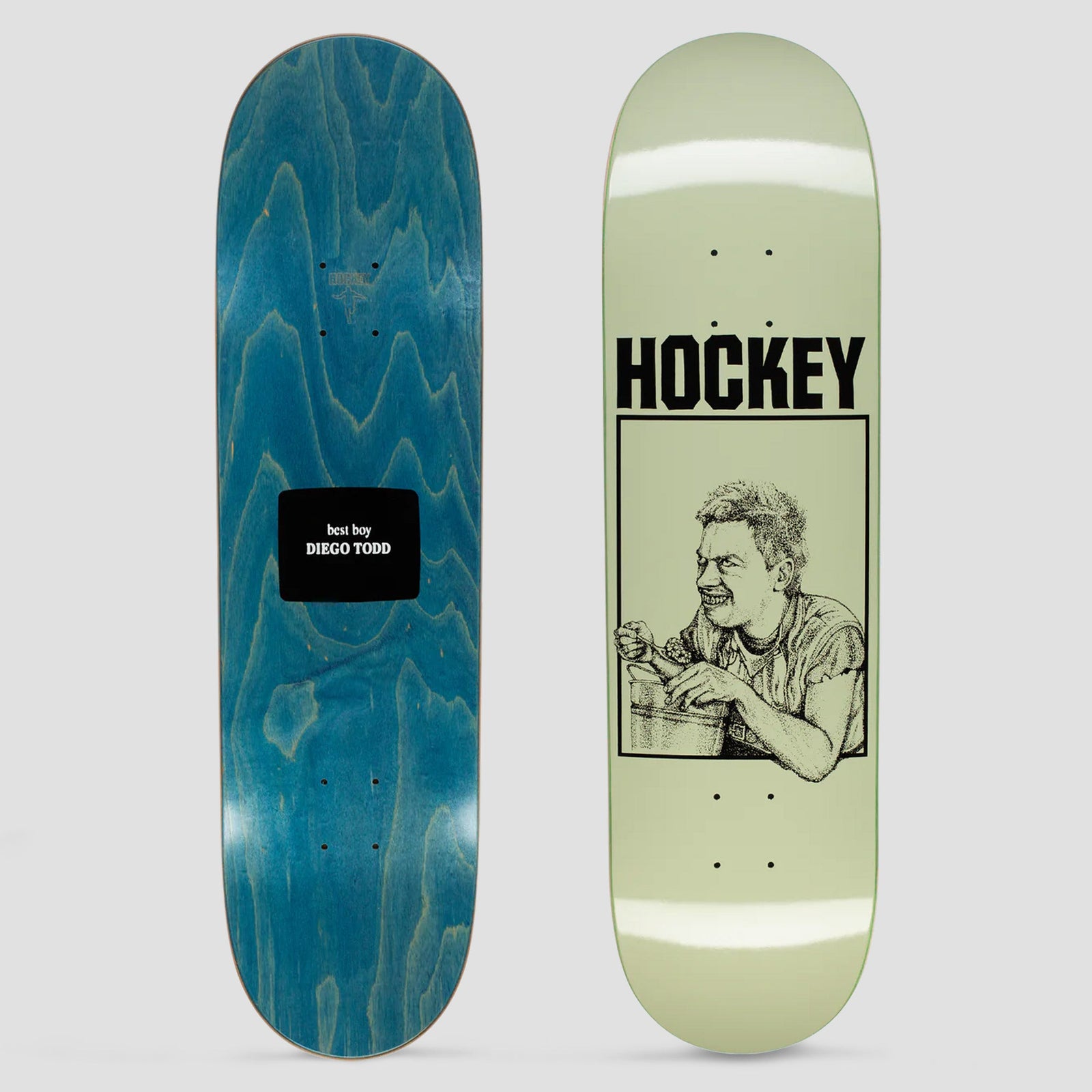 Hockey Diego Todd Bucket Boy Green skateboard deck: Pale green deck with bold black Hockey lettering above a boxed pen-and-ink drawing of a grinning man eating from a bucket. Underside is blue-stained with a black label reading best boy Diego Todd.