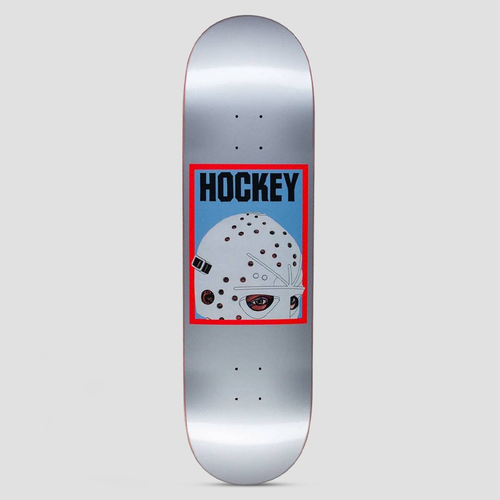 Hockey Half Mask Silver skateboard deck: Red-framed blue panel on a silver deck showing half of a white hockey goalie mask with an eye peering out, with Hockey in black capitals above.