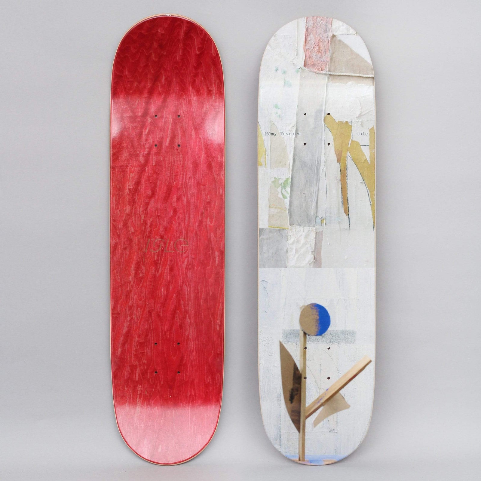 Isle Taveira Sculpture Series skateboard deck: Abstract collage of torn paper, plaster and paint in pale greys and creams with a gold streak, and a small cardboard sculpture of a stem and leaves topped with a blue and brown disc. Red underside shown alongside.