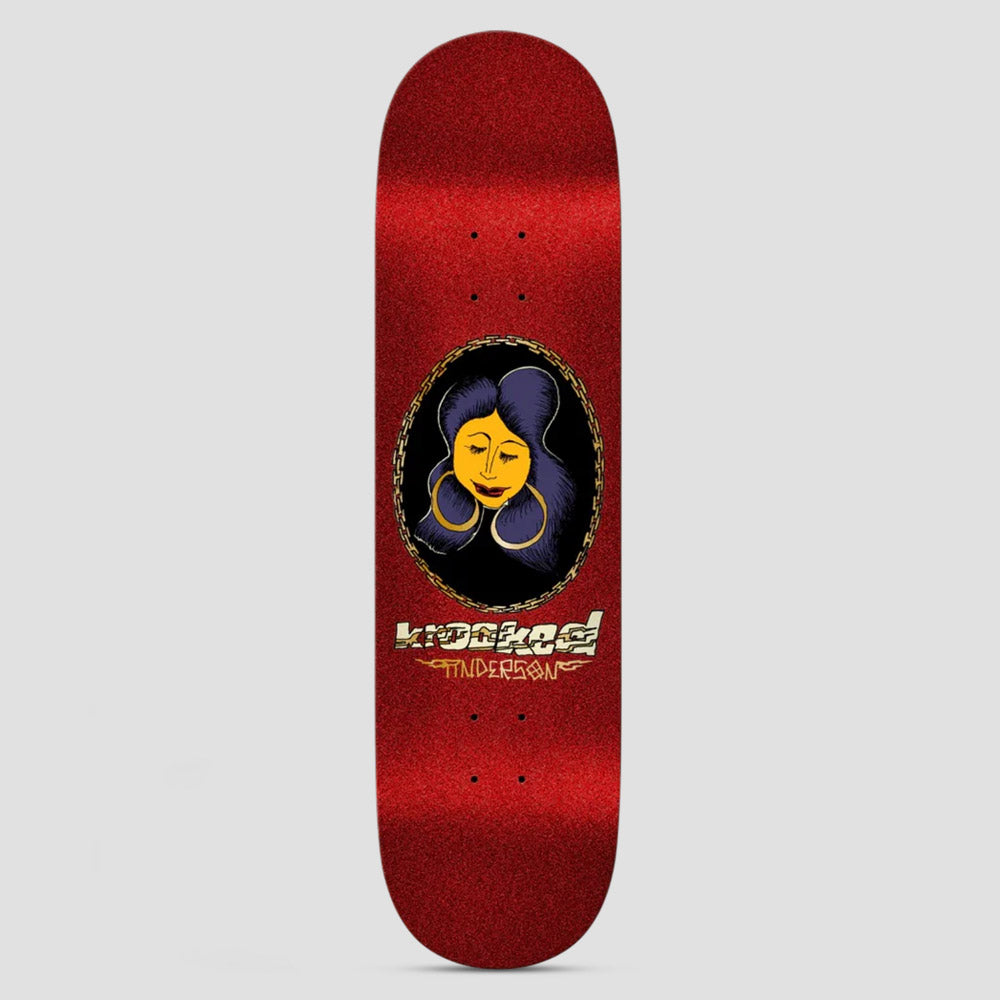 Krooked Manderson Chain Frame DBX Red skateboard deck: Glittery red deck with an oval portrait in a gold chain frame, showing a woman with an orange face, closed eyes, big gold hoop earrings and dark purple hair. Krooked logo and name in gold lettering below.
