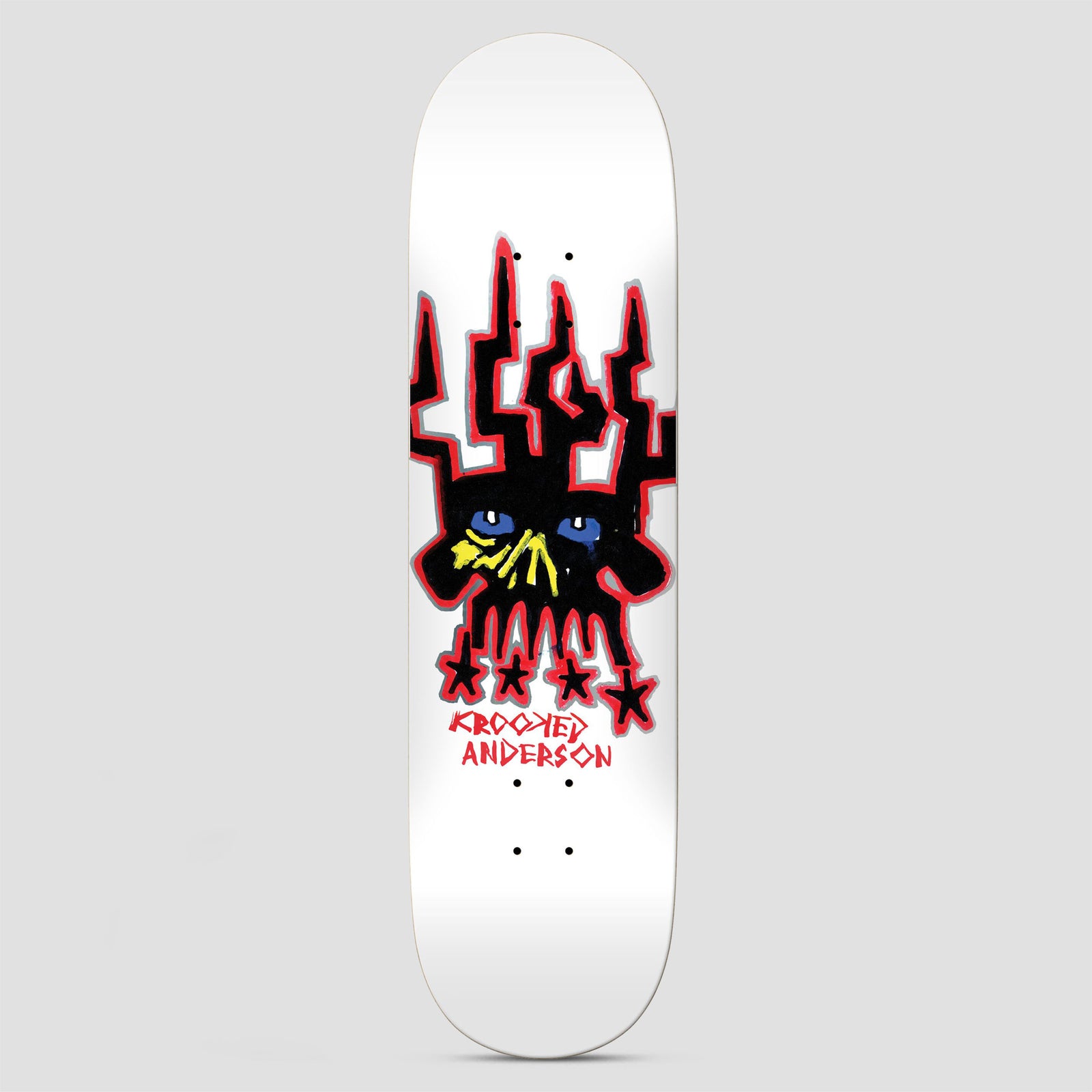 Krooked Manderson Skull King SF skateboard deck: White deck with a crudely drawn black skull wearing a spiky crown, with blue eyes and a yellow nose, outlined in red and grey. Four black stars sit below the teeth, above Krooked Anderson in red.
