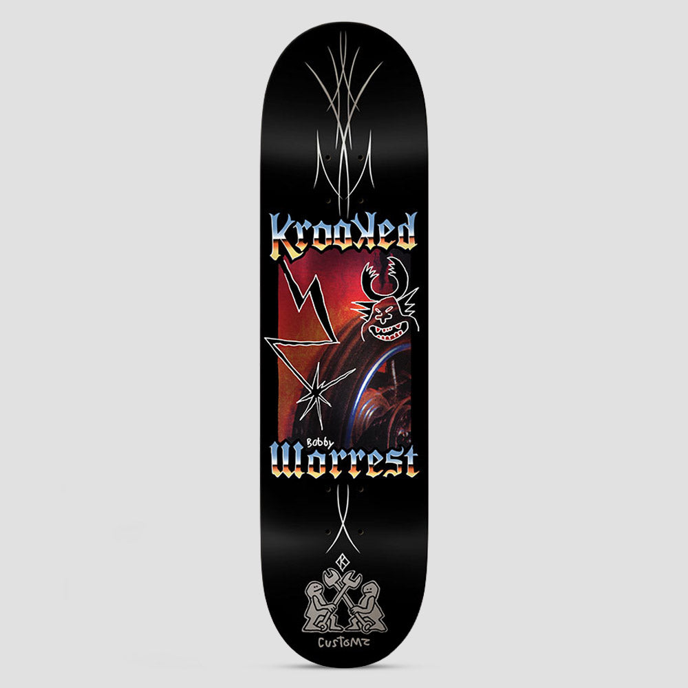 Krooked Worrest Chrome Zone Twin Tail Black skateboard deck: Chrome-gradient blackletter Krooked and Worrest lettering frames a red photo panel with a lightning bolt, a star burst and a doodled horned grinning demon face. Silver pinstripes run along the deck and two figures with wrenches sit at the tail.