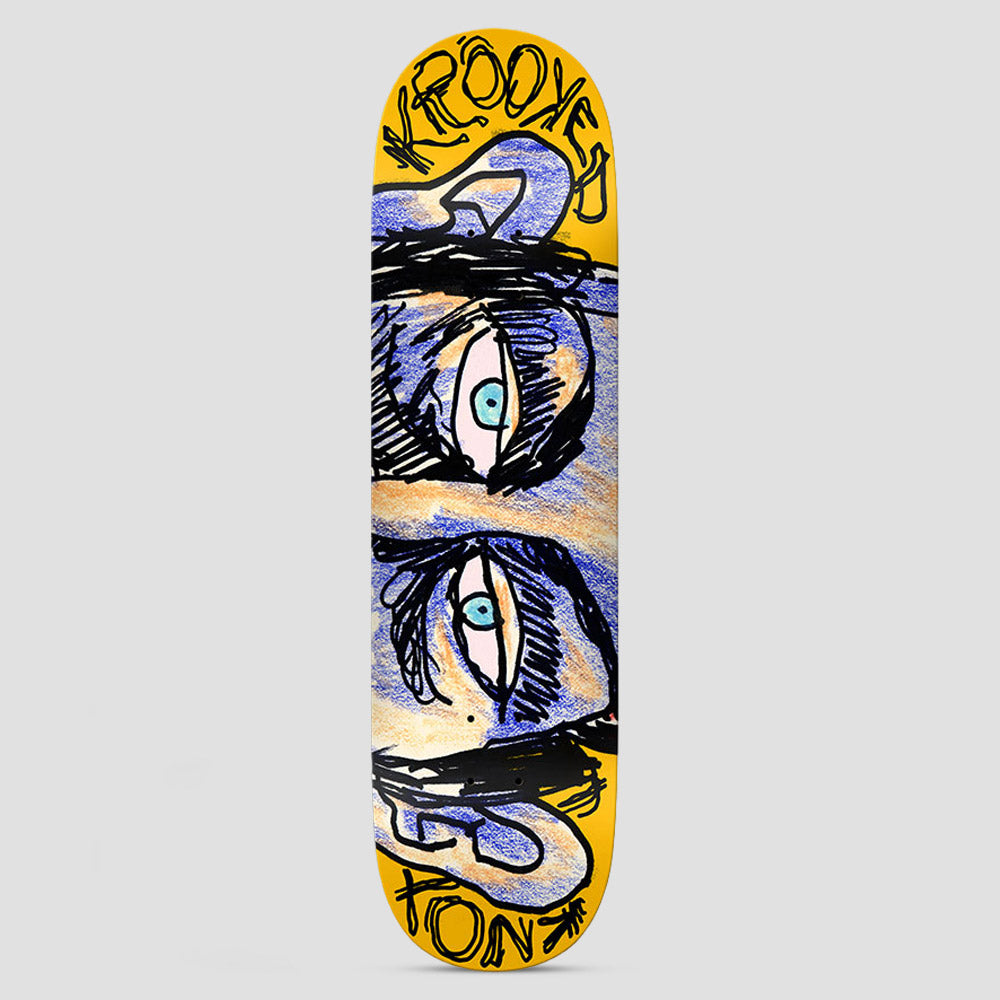 Krooked Knox Watcher Yellow skateboard deck: Crayon-and-ink drawing of a pair of staring blue eyes with heavy black brows and ears, mirrored top and bottom, on a yellow deck. Scrawled Krooked lettering and rider name at the ends.
