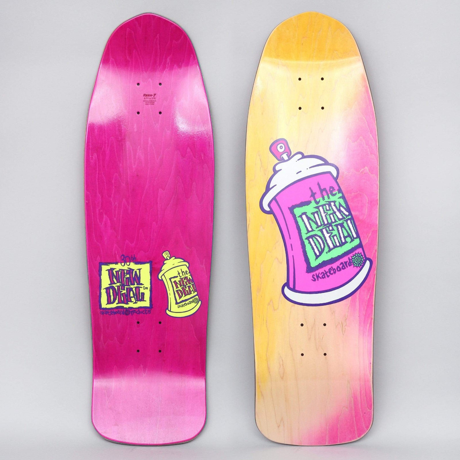 New Deal Spray Can Neon skateboard deck: Tilted pink spray can with white cap bearing the New Deal logo in green and yellow lettering, on a yellow and pink stained old-school shape. Underside shows a smaller yellow can and logo on pink.
