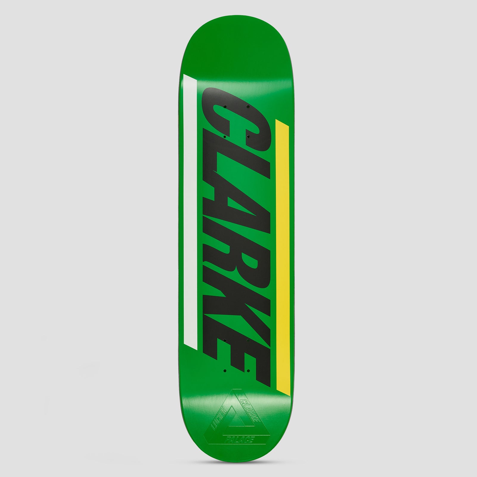 Palace Lucien Pro S43 skateboard deck: Green deck with the rider name CLARKE in large black slanted capitals running along the board, flanked by a white stripe and a yellow stripe. An embossed Palace triangle logo sits near the tail.