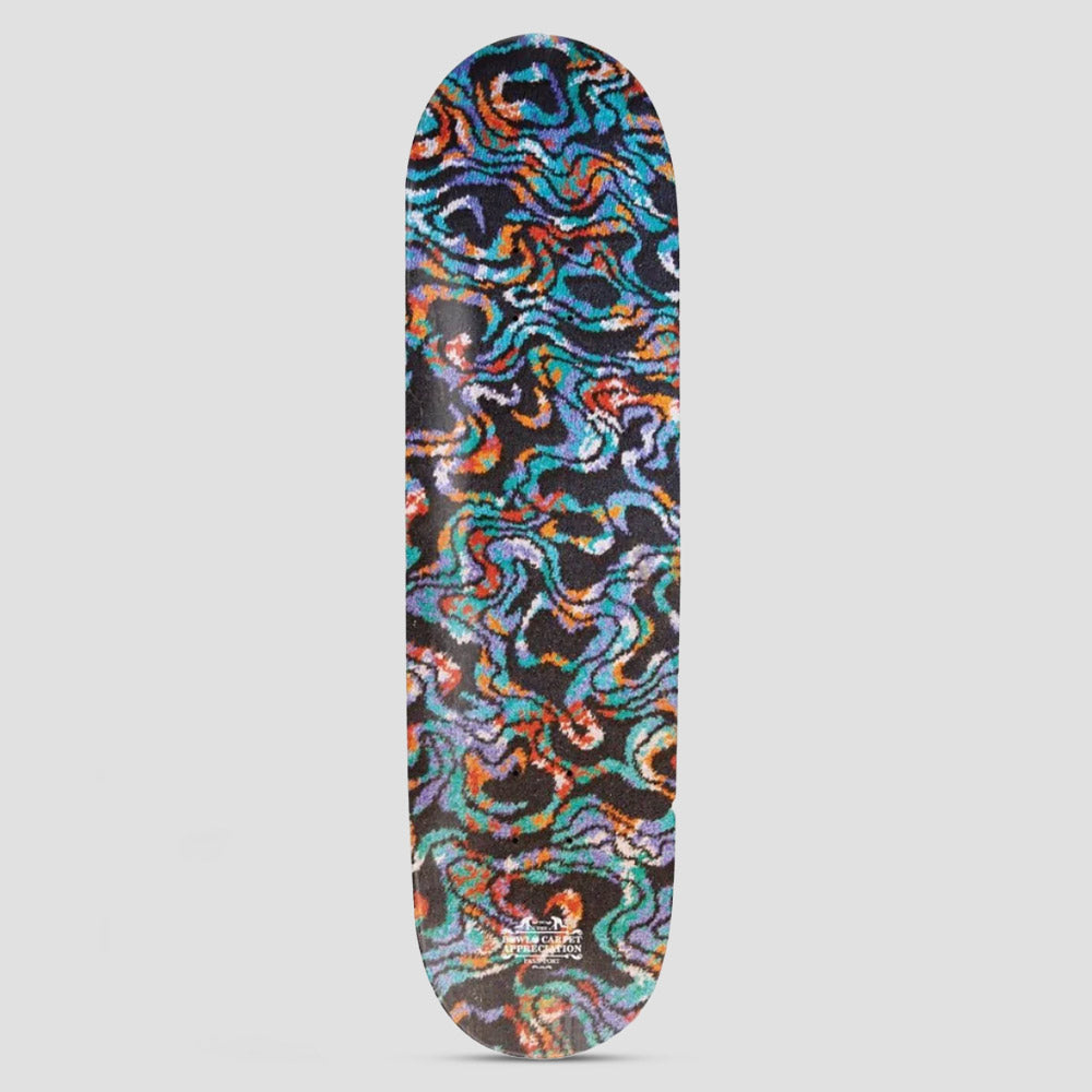 Passport Bowlo Carpet Appreciation Junction skateboard deck: All-over photograph of a swirling, tufted carpet pattern in wavy ribbons of teal, orange, purple and cream on a dark ground, with small white text near the tail.