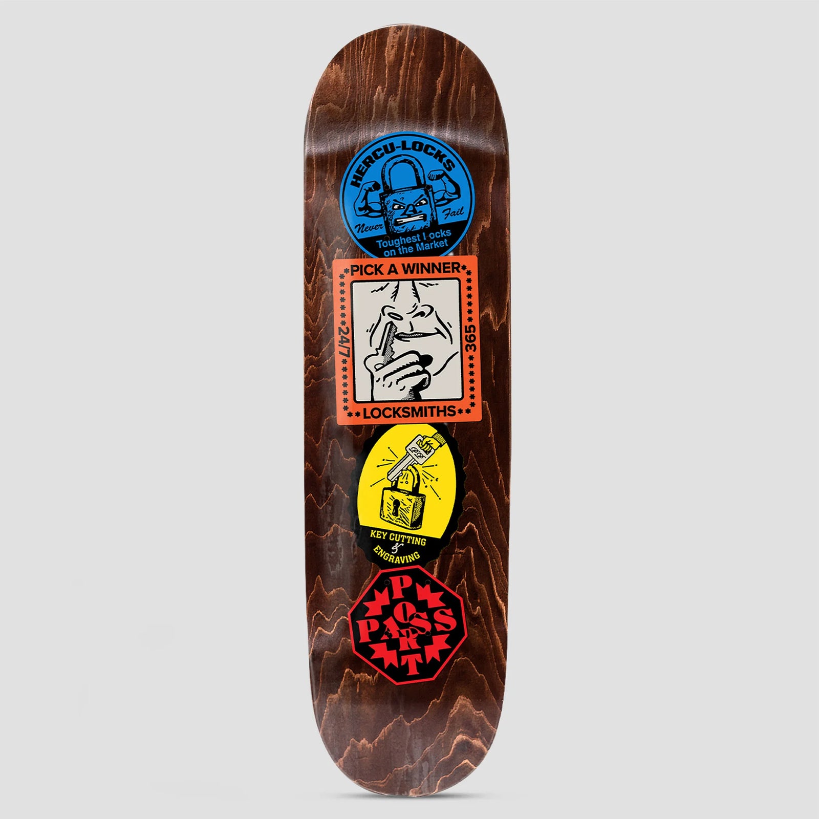 Passport Coaster Series Locksmith skateboard deck: Four stacked sticker-style labels on dark brown wood: a blue padlock with muscled arms, an orange 'Pick a Winner' locksmith panel with a hand and nose, a yellow key and padlock badge, and a red octagonal brand logo.