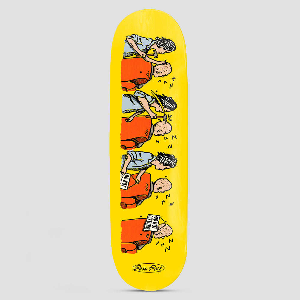 Passport Over It Series DND skateboard deck: Cartoon strip of four panels on yellow: a long-haired person hits a bald, snoring man in an orange chair with a hammer, then tapes a note to him. He finishes holding a 'Do Not Disturb' sign.
