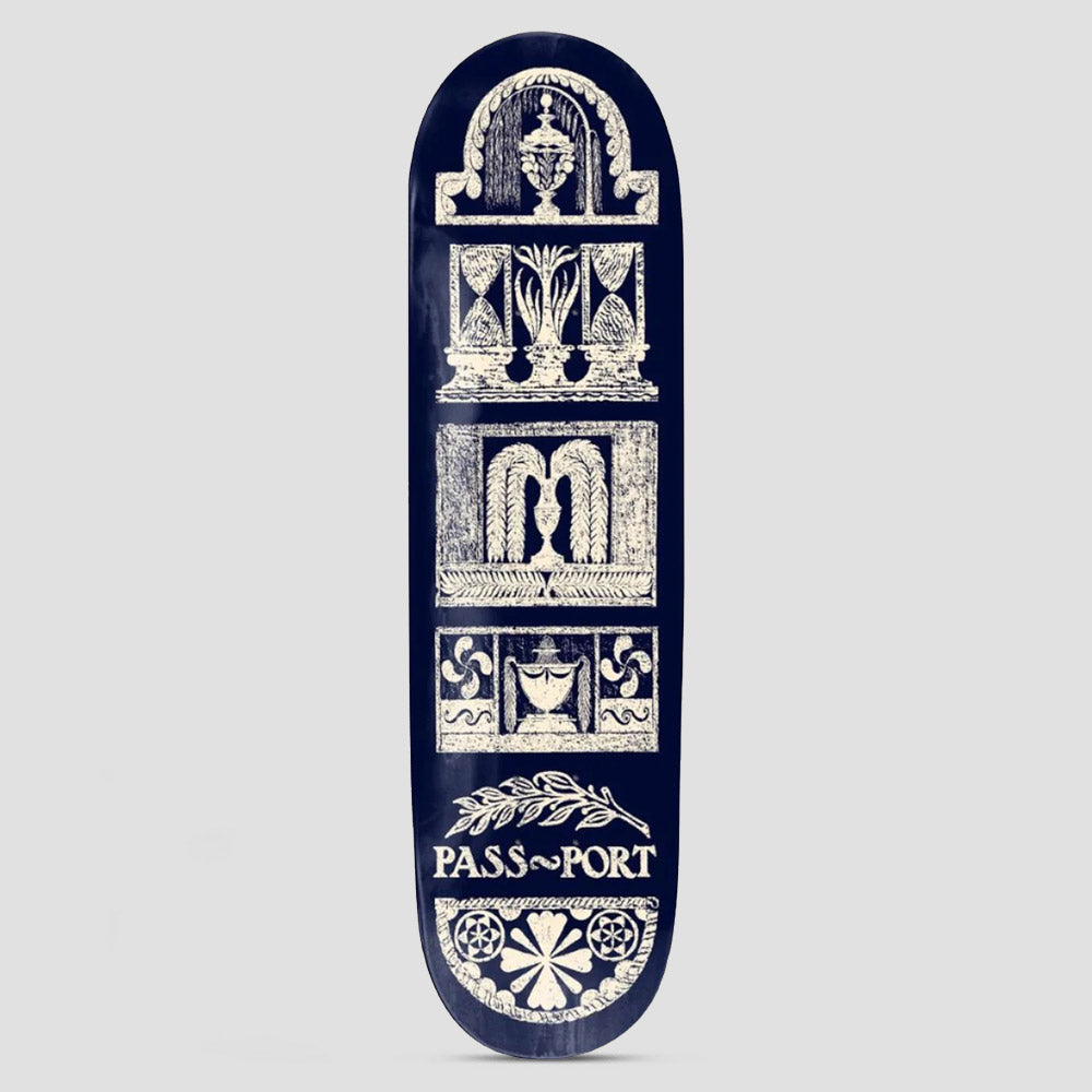 Passport Rubbings Series Court Yard skateboard deck: Cream rubbing-style architectural panels stacked down a navy deck: urns, hourglass-like columns, curtained niches, pinwheels and a floral rosette, with a laurel sprig above the Passport name.