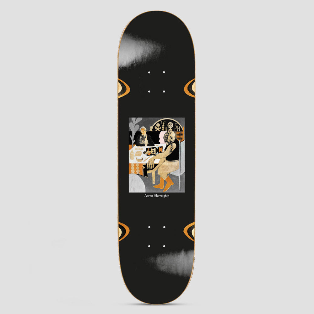 Polar Aaron Herrington Tea Riders Surf Jr Wheel Wells skateboard deck: Illustrated square panel of a tattooed man seated at a laid table, with a seated figure behind him and symbols on the wall, in muted orange, grey and black. Orange eye-like shapes sit at the wheel wells on a black deck.