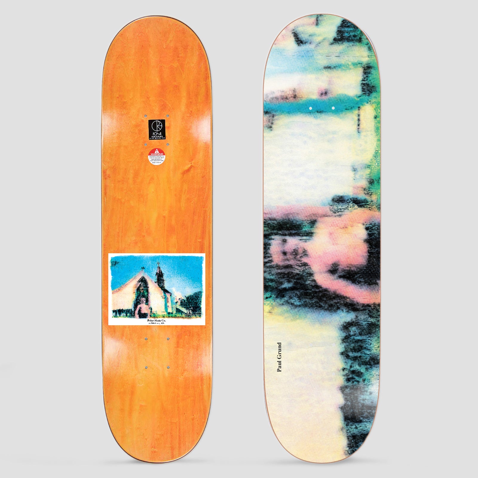 Polar Paul Grund Devil skateboard deck: Blurred, smeared photographic image in pastel yellow, pink, teal and dark green showing an indistinct figure, with Paul Grund in small serif type. The underside has an orange stain and a small photo of a chapel.