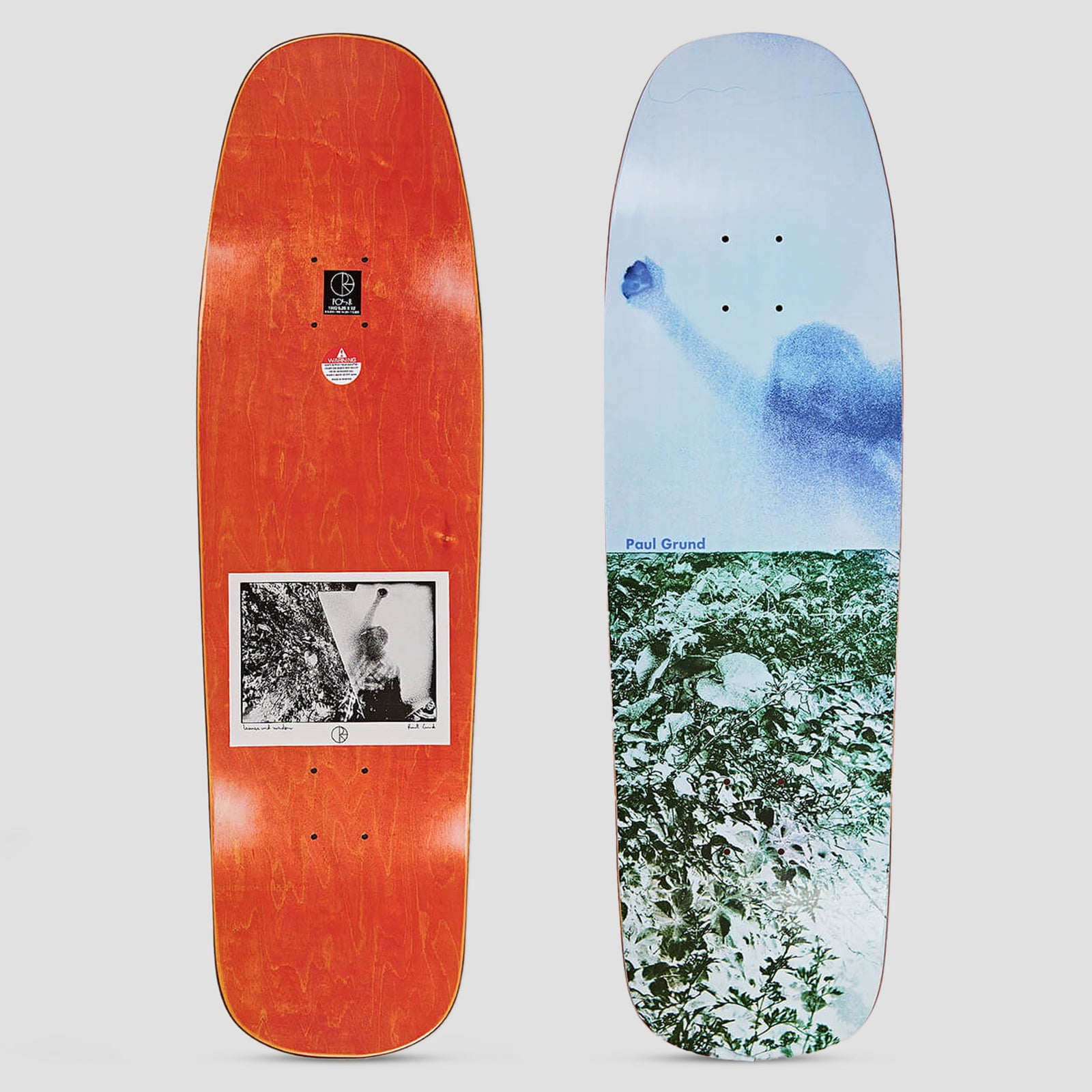 Polar 1992 Paul Grund Man With Window skateboard deck: Shaped deck with a faded blue-toned photo of a figure raising a fist against a pale sky, above a green-tinted photo of foliage. Paul Grund name in blue at the join. Underside shows an orange stain with a small black and white photo.