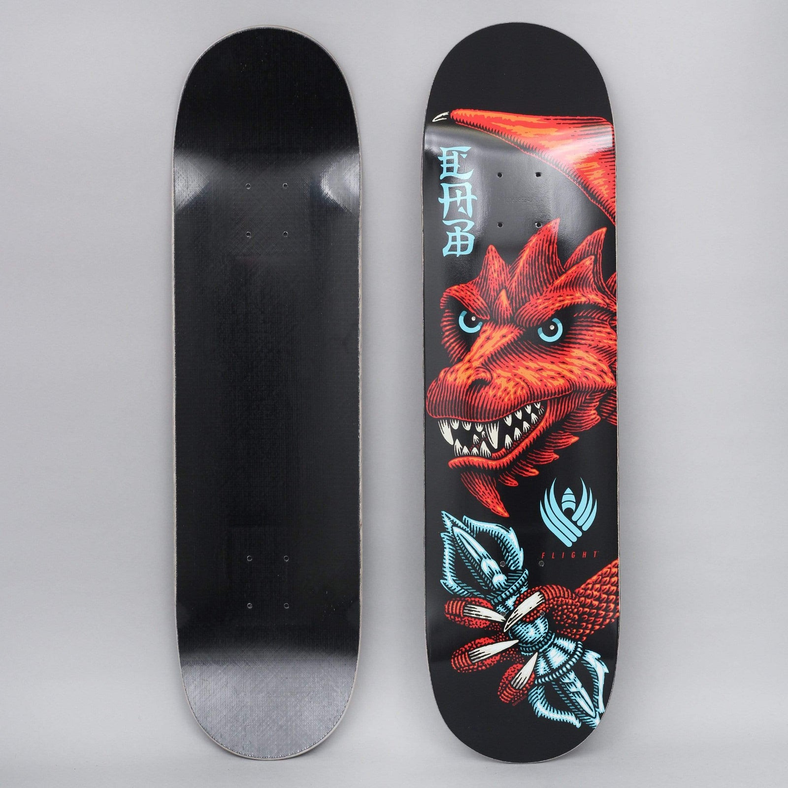 Powell Peralta Peralta 8.25 Cab Dragon Wing 243 Flight skateboard deck: A red engraved-style dragon head with pale blue eyes and bared teeth, wing spread behind it, clutching a pale blue vajra in its claw. Vertical blue kanji-style lettering and a Flight logo sit on a black ground.