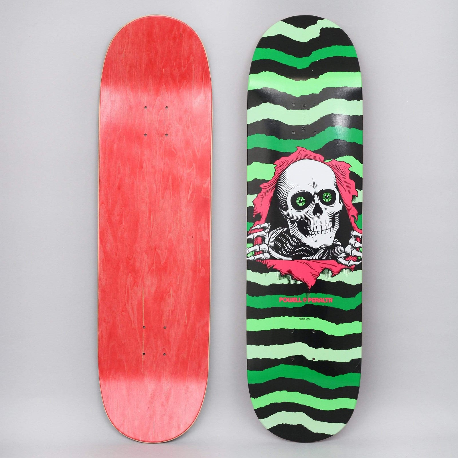 Powell Peralta Peralta 8.75 Ripper Shape 245 Green skateboard deck: Powell Peralta Ripper skull with green eyes and skeletal hands tearing through a pink rip, over wavy green and black torn-edge stripes. Powell Peralta name in pink beneath. Photo also shows the red underside.