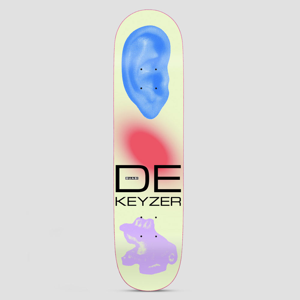 Quasi Quasi 8.5 De Keyzer Ear skateboard deck: A large blue halftone ear at the top, a blurred pink glow in the middle and a lilac toy-like object at the bottom, on a pale lime deck. Large black DE KEYZER lettering with a small Quasi logo.