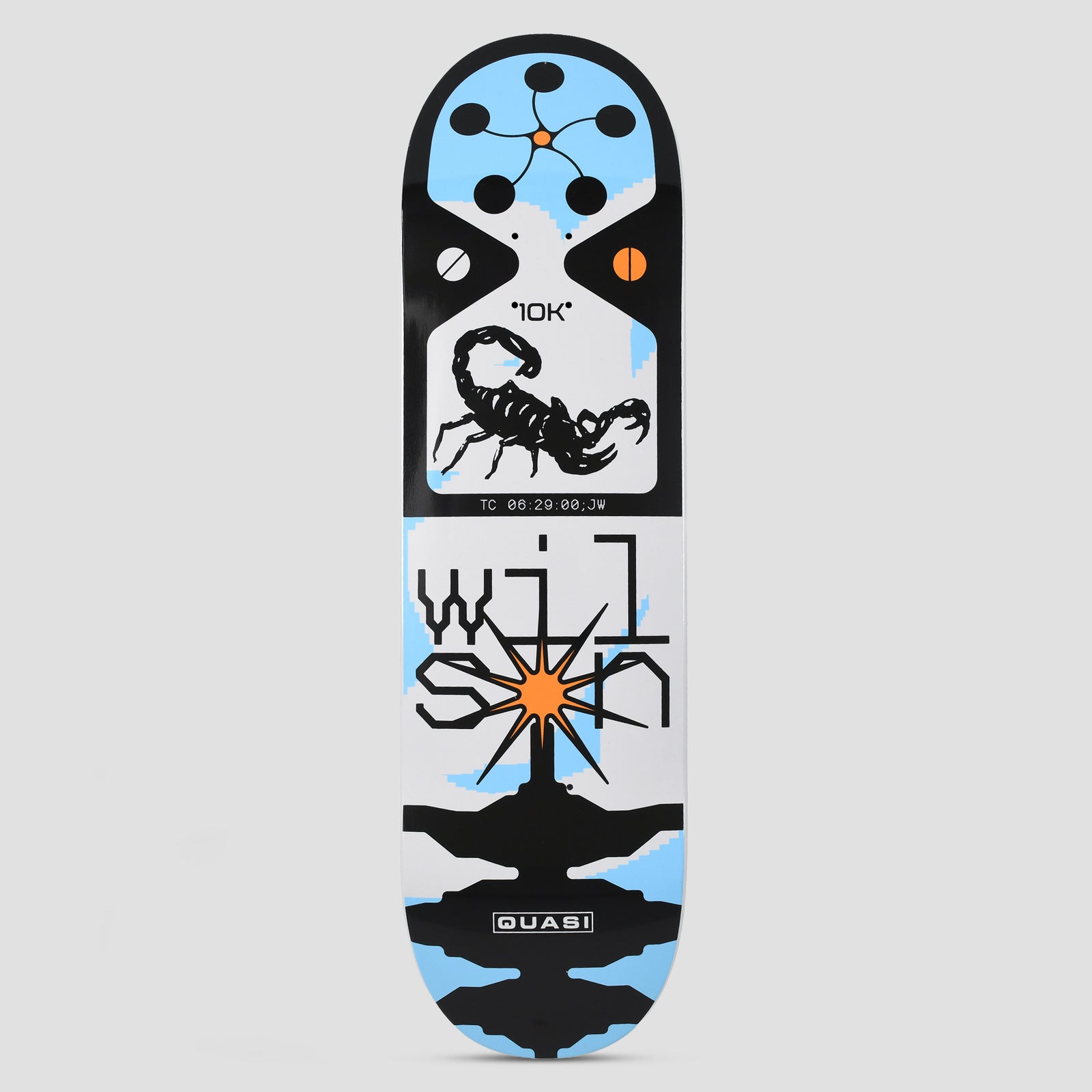 Quasi Quasi 8.75 Wilson Y2K skateboard deck: A black scorpion in a white panel marked 10K, with a timecode caption, above pixel-style lettering spelling Wilson around an orange starburst, on a white, black and pale blue geometric layout with circles and symmetrical shapes.