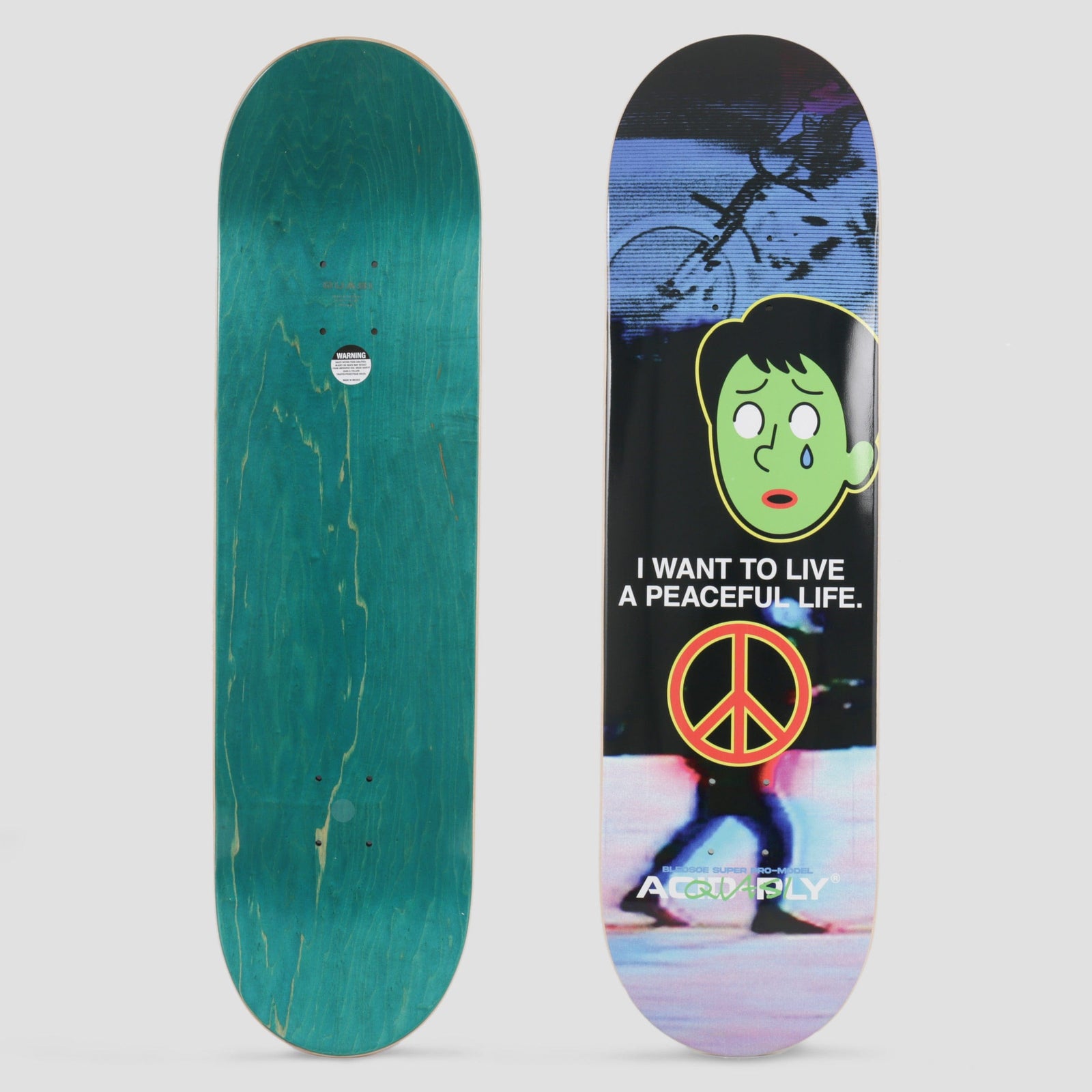 Quasi Quasi 8.375 Bledsoe Acid Ply 2 skateboard deck: Cartoon of a crying green face with black hair above a red and orange peace symbol, over a blurred night photo of a walking figure. A slogan sits between them.
