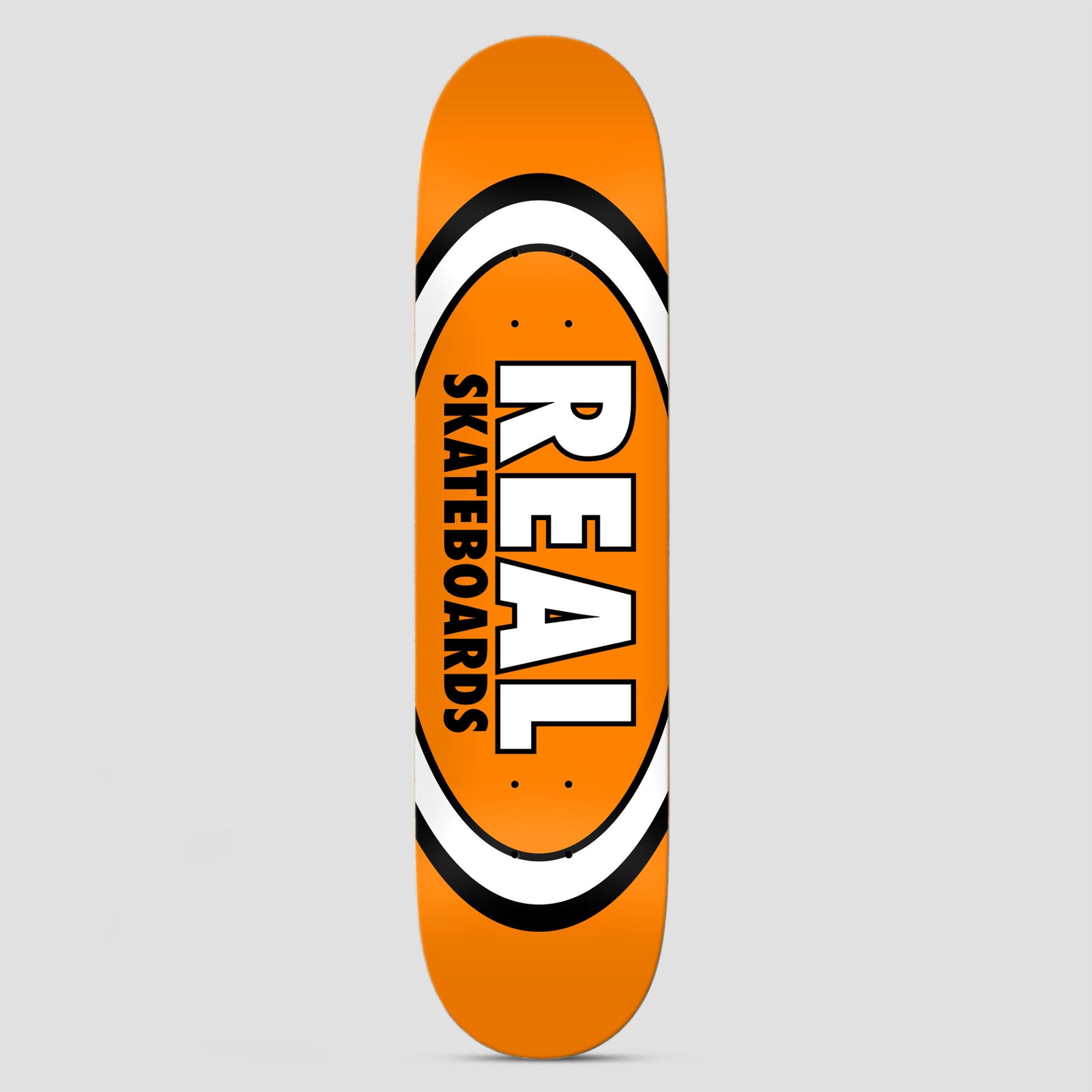 Real Team Classic Oval True Mid Orange skateboard deck: Classic Real oval logo in white and black bands on a bright orange deck, with REAL in large white block letters and SKATEBOARDS in black beside it.