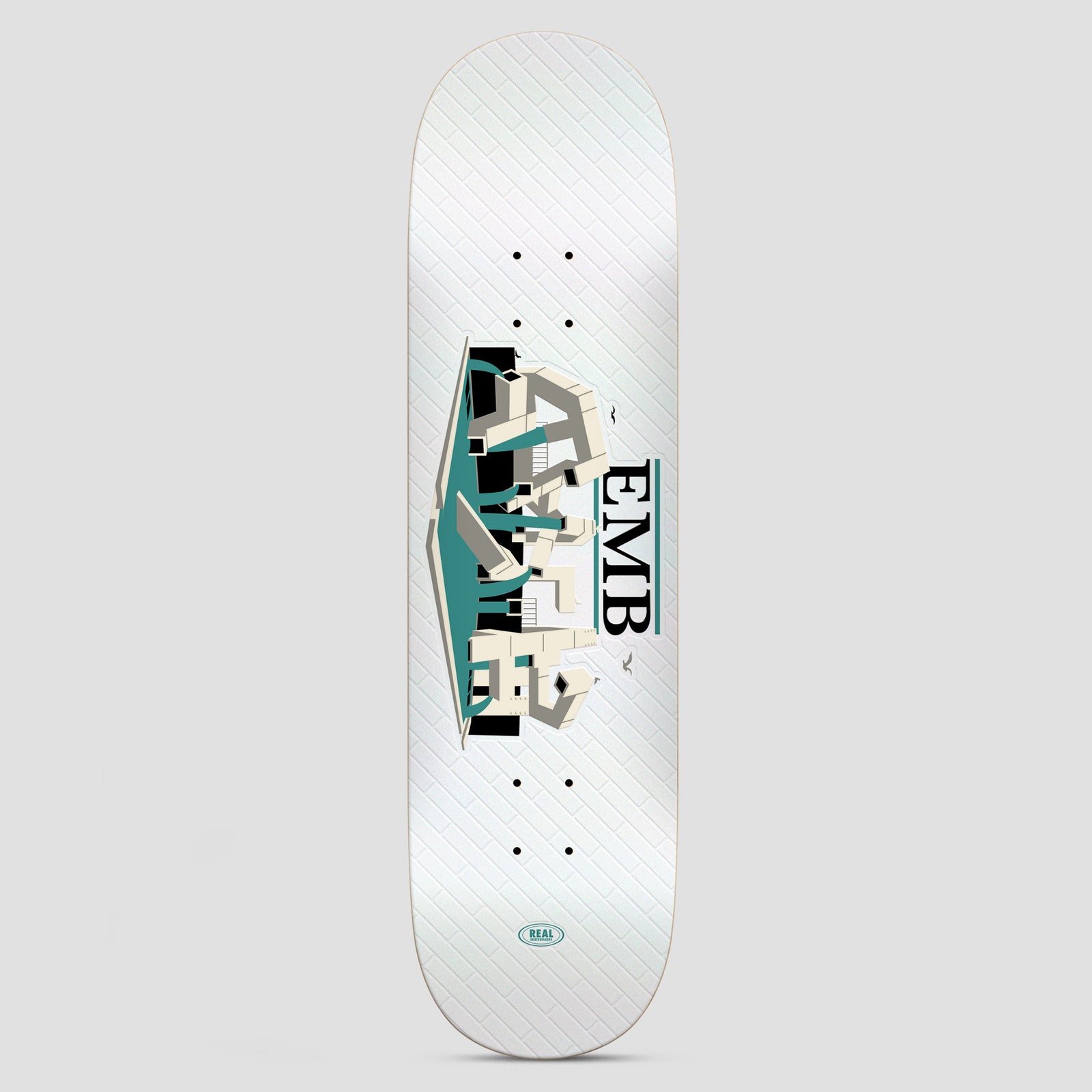 Real Team EMB White skateboard deck: A white deck with a faint brick pattern carries an illustrated EMB (Embarcadero) scene in cream, teal and black: a tangle of concrete ledges and stairs with seagulls. The Real logo sits at the tail.