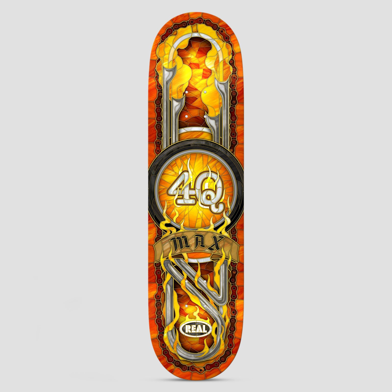 Real Max Schaff 4Q Cathedral MX Orange skateboard deck: A stained-glass style design in oranges and yellows, centred on a motorbike wheel with '4Q' on a flaming hub, with chrome handlebars and an exhaust above and below. A gold scroll banner carries the rider's first name.