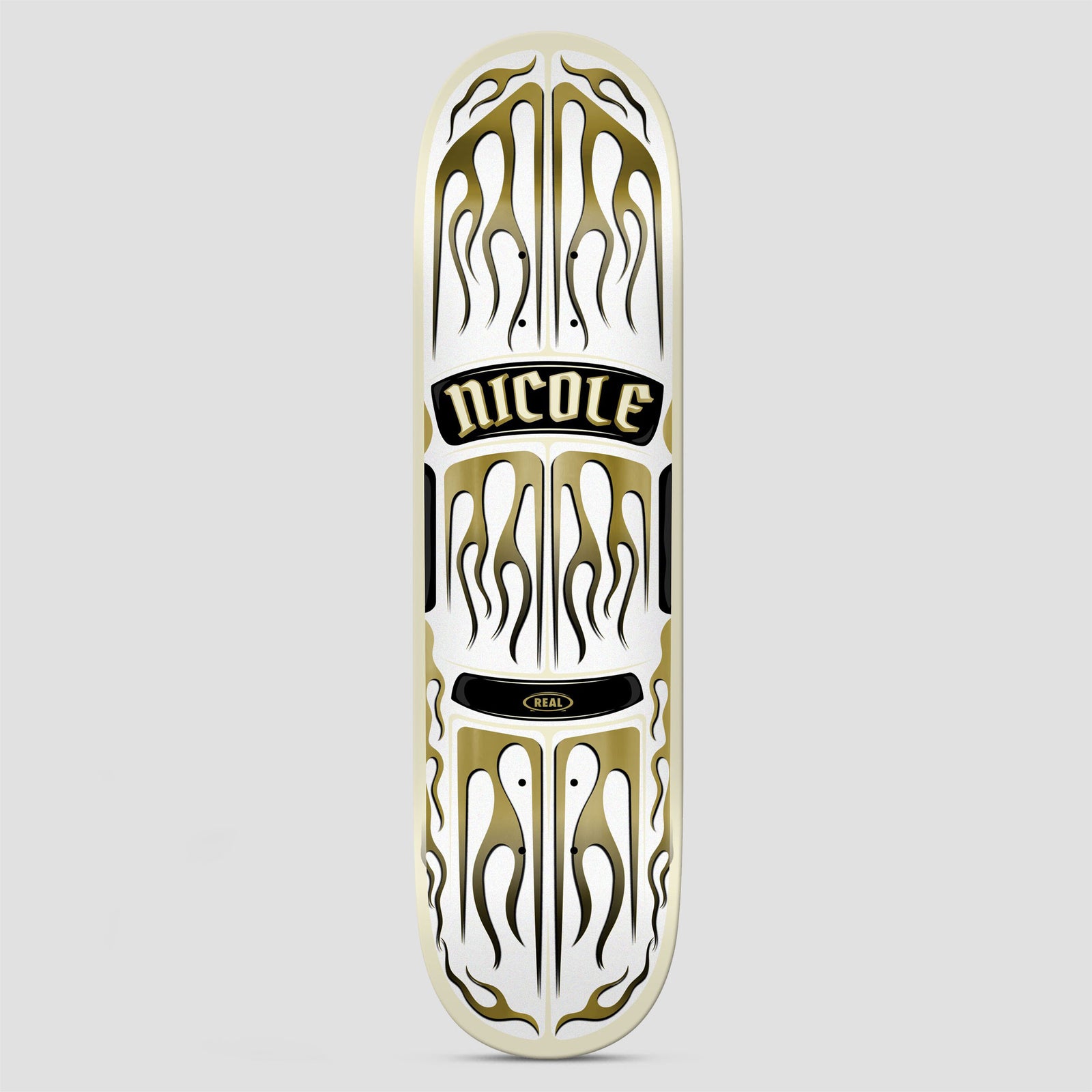 Real Nicole Ember skateboard deck: Symmetrical gold-and-white flame pattern resembling a custom car bonnet, with a black plate reading NICOLE in gothic lettering and a small Real logo plate below. Cream edge.