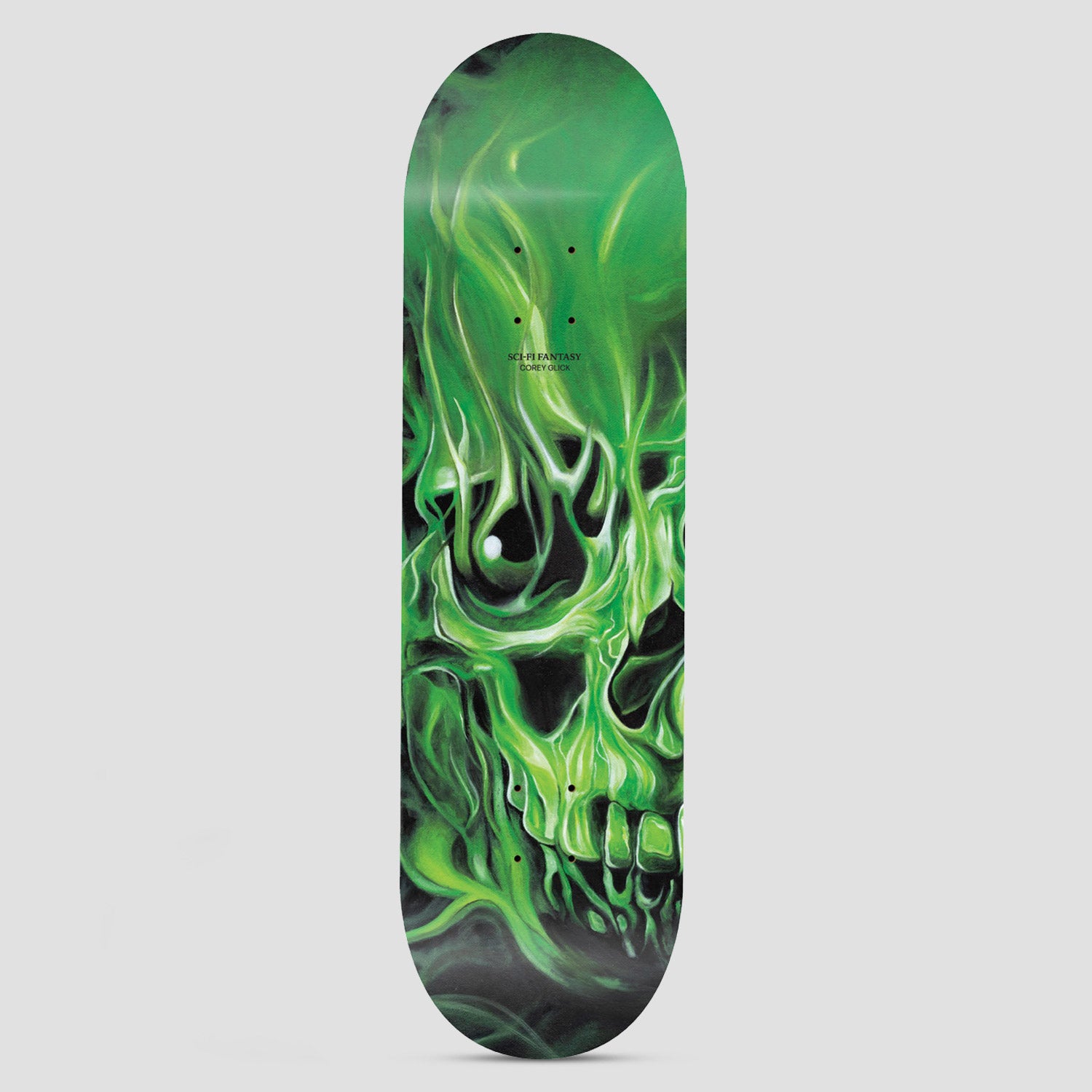 Sci-Fi Fantasy Corey Glick Skulls Green skateboard deck: Airbrushed close-up of a skull wreathed in swirling green flames against a dark background, with small brand and rider text on the upper deck.