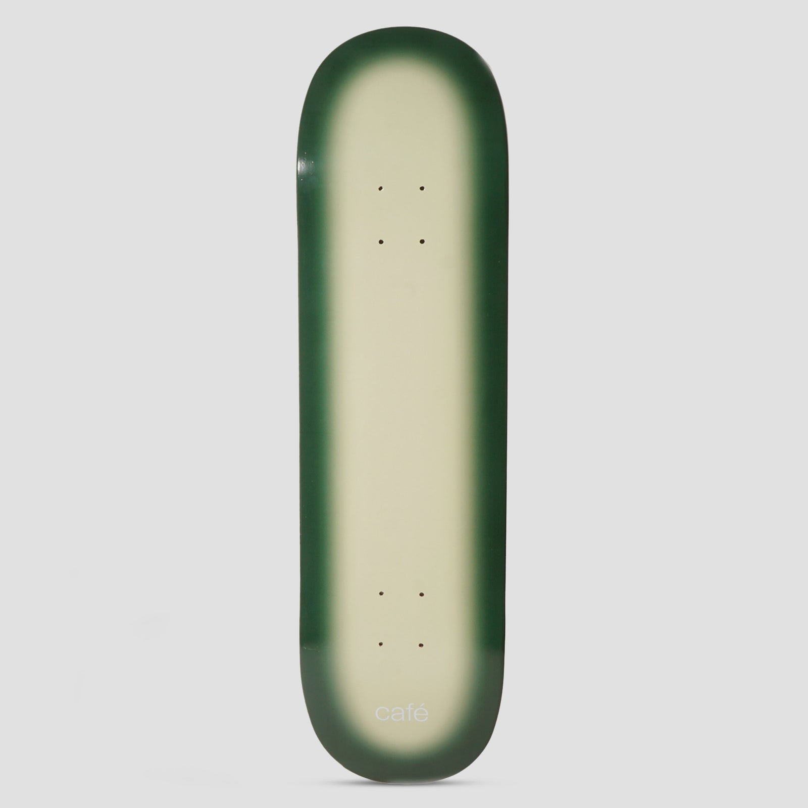 Skateboard Cafe Fade Ecru / Forest Green skateboard deck: Plain ecru deck with a soft airbrushed forest green fade around the edges, and a small white 'café' wordmark near the tail.