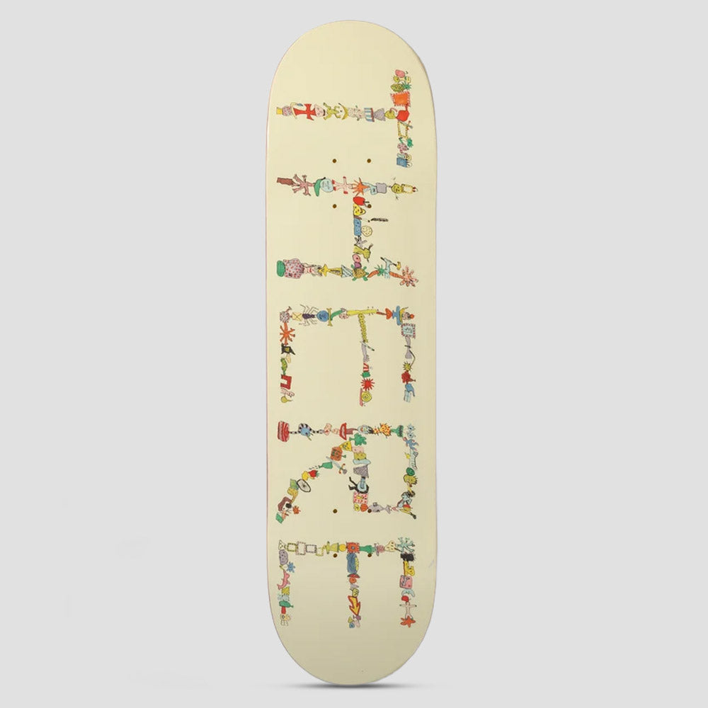 There Team Detritus Beige skateboard deck: Cream deck with the brand name spelt out lengthways in letters built from tiny hand-drawn objects, figures, plants and doodles in many colours, like a collage of found items.