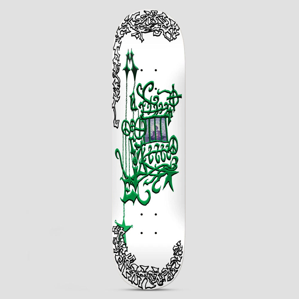 There Marie De Courey Magic Lies In The Healing White skateboard deck: Ornate green gothic-style calligraphic lettering with chains and stars around a small purple framed image of a seated figure, with black scribbled border lettering at the corners, on white.