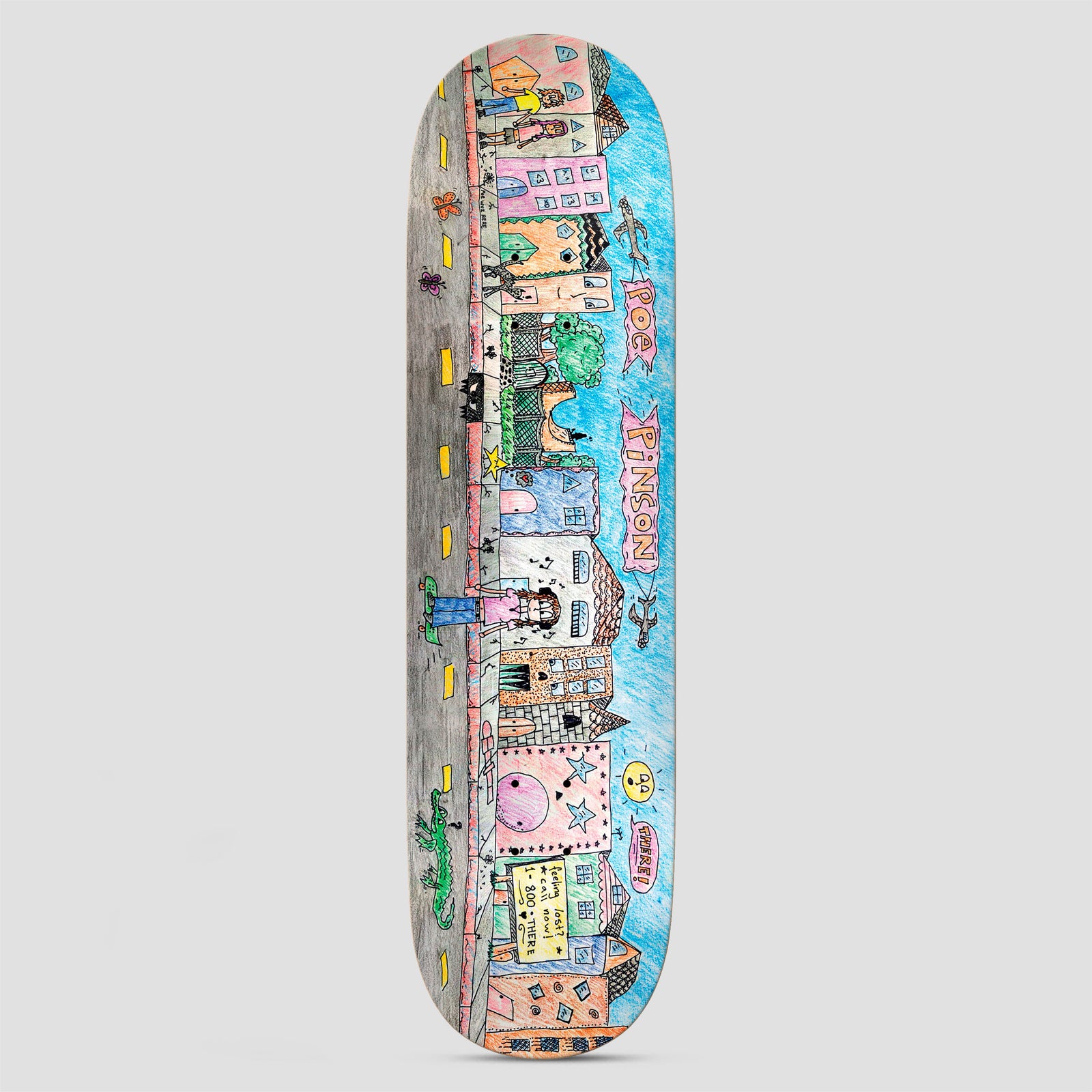 There Poe Poe Wuz Here Multi skateboard deck: A child-like coloured-pencil drawing of a street of colourful houses and shops, with figures, a crocodile, a bird and butterflies, along a grey road with yellow dashes under a blue sky. Pink lettering names the rider.