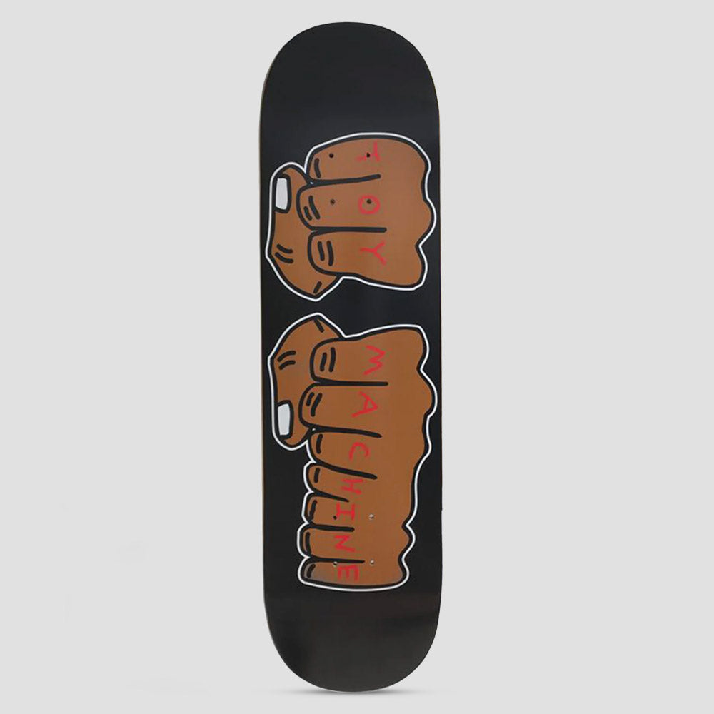 Toy Machine New Fists Black skateboard deck: Two brown clenched fists with white outlines, the knuckles hand-lettered in red to spell TOY MACHINE, on a plain black deck.