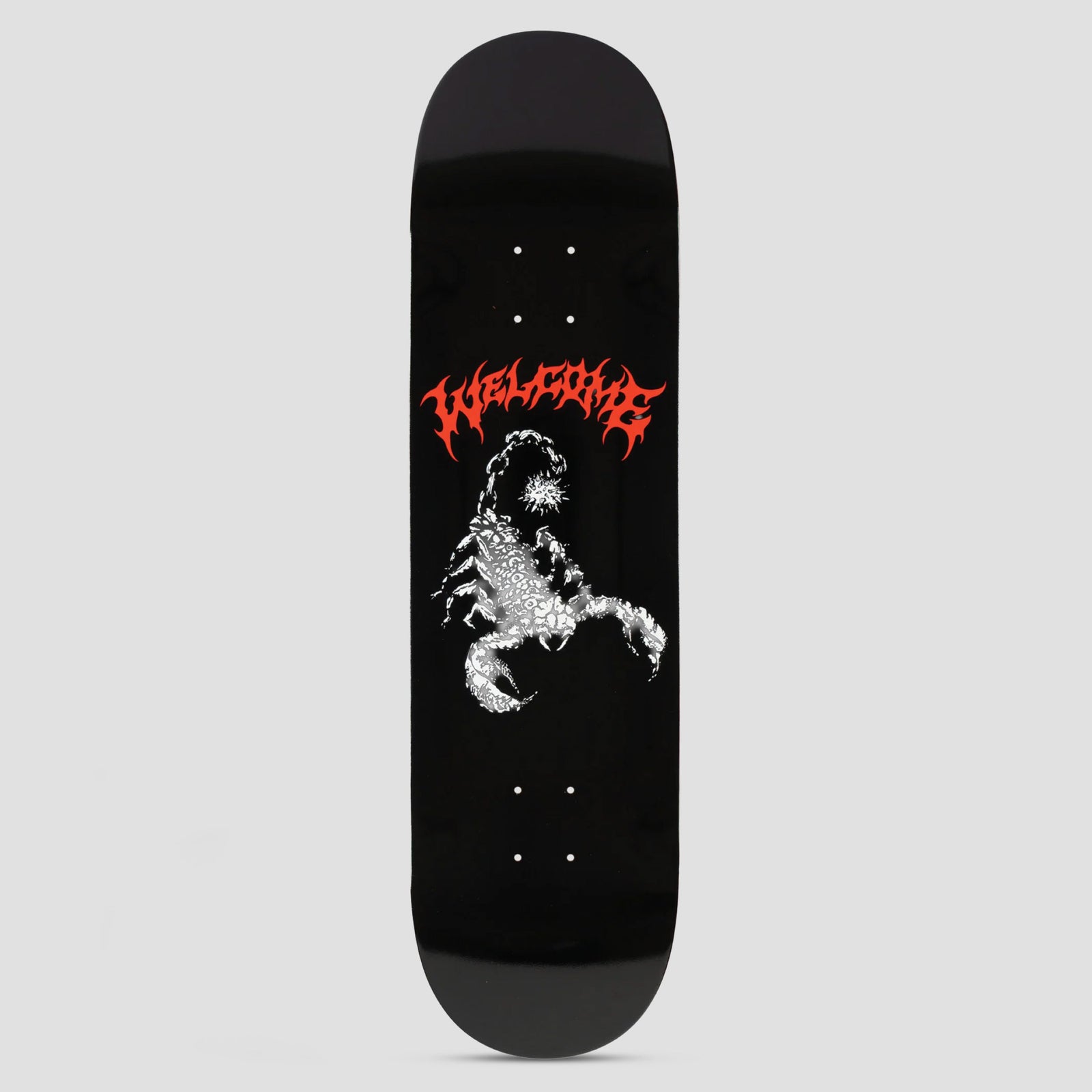 Welcome Mace Black skateboard deck: A white and grey scorpion with a spiky tail, drawn in a detailed engraved style, beneath the brand name in red metal-band lettering on a black deck.