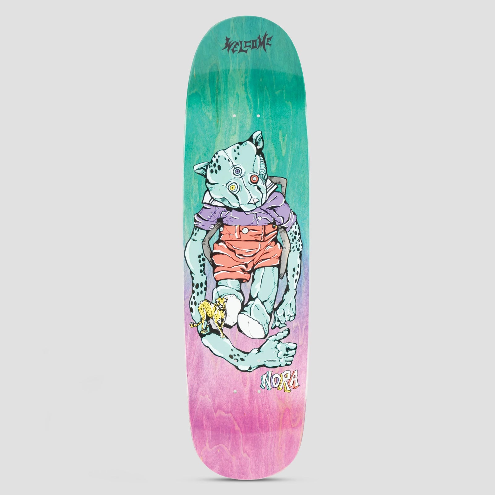 Welcome Teddy Nora Teal / Purple Gradient Stain skateboard deck: A mint-green leopard-headed teddy bear with mismatched eyes, in a purple shirt and coral shorts, sits slumped with long limbs, holding a tiny cheetah. Welcome logo above, Nora below, on a teal-to-pink stained deck.