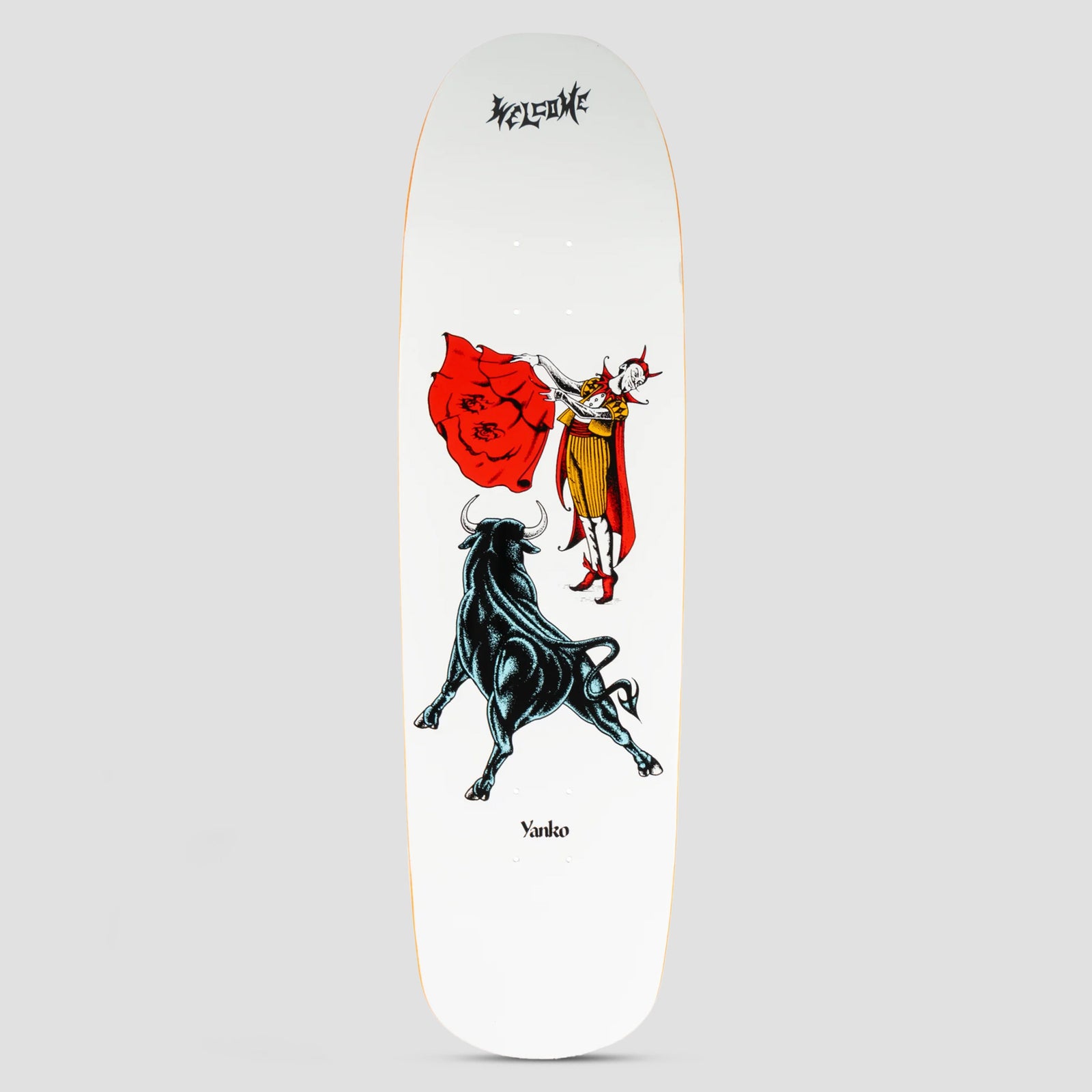 Welcome Matador Jake Yanko Pro Model on Panther White skateboard deck: A horned devil-like matador in a gold-striped costume holds up a red cape facing a charging black bull, drawn in a tattoo flash style on a white deck, with the Welcome logo at the top and Yanko at the bottom.