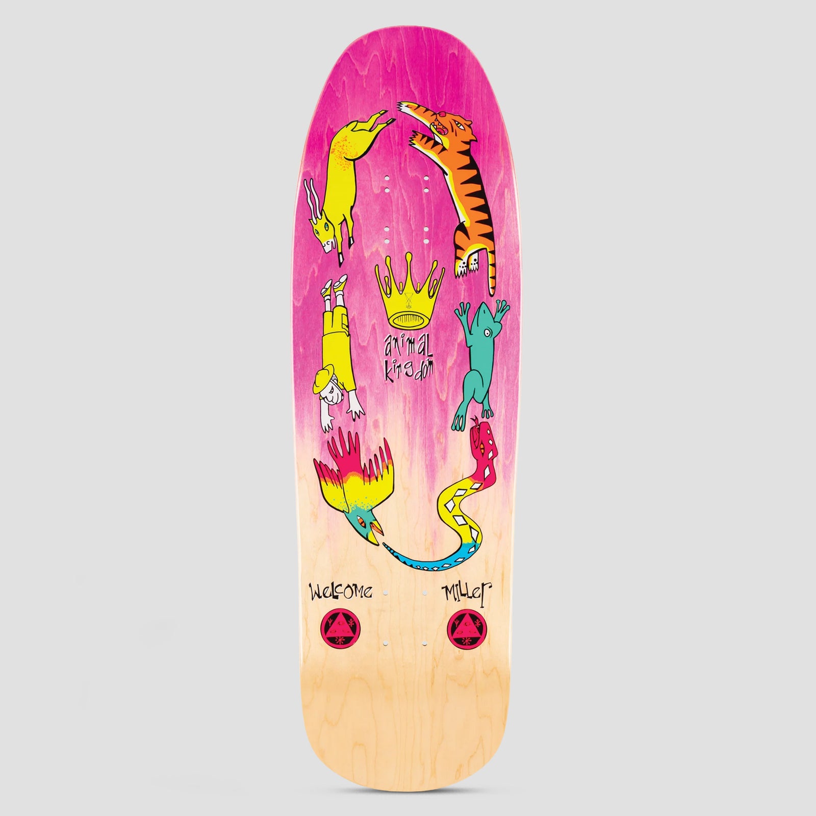 Welcome Animal Kingdom Chris Miller Pink / Natural Stain skateboard deck: Retro-shaped deck with a pink-to-natural stain. Animals and a person tumble in a ring around a gold crown: a goat, tiger, frog, snake, parrot and a figure in yellow. Welcome and Miller are lettered at the bottom.